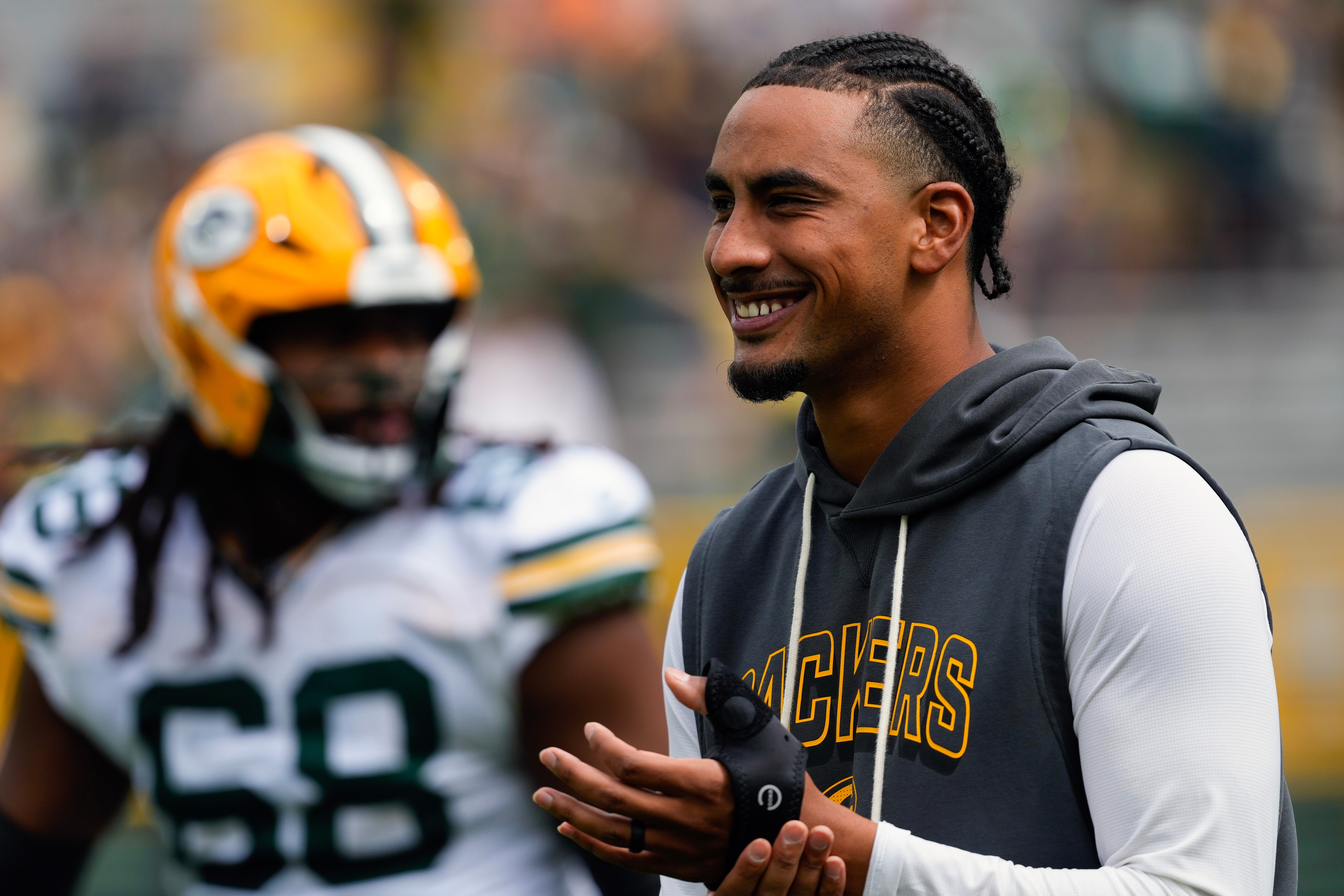 Aug 23, 2025; Green Bay, Wisconsin, USA; Green Bay Packers quarterback Jordan Love (10) looks on during warmups prior to the game against the Seattle Seahawks at Lambeau Field.