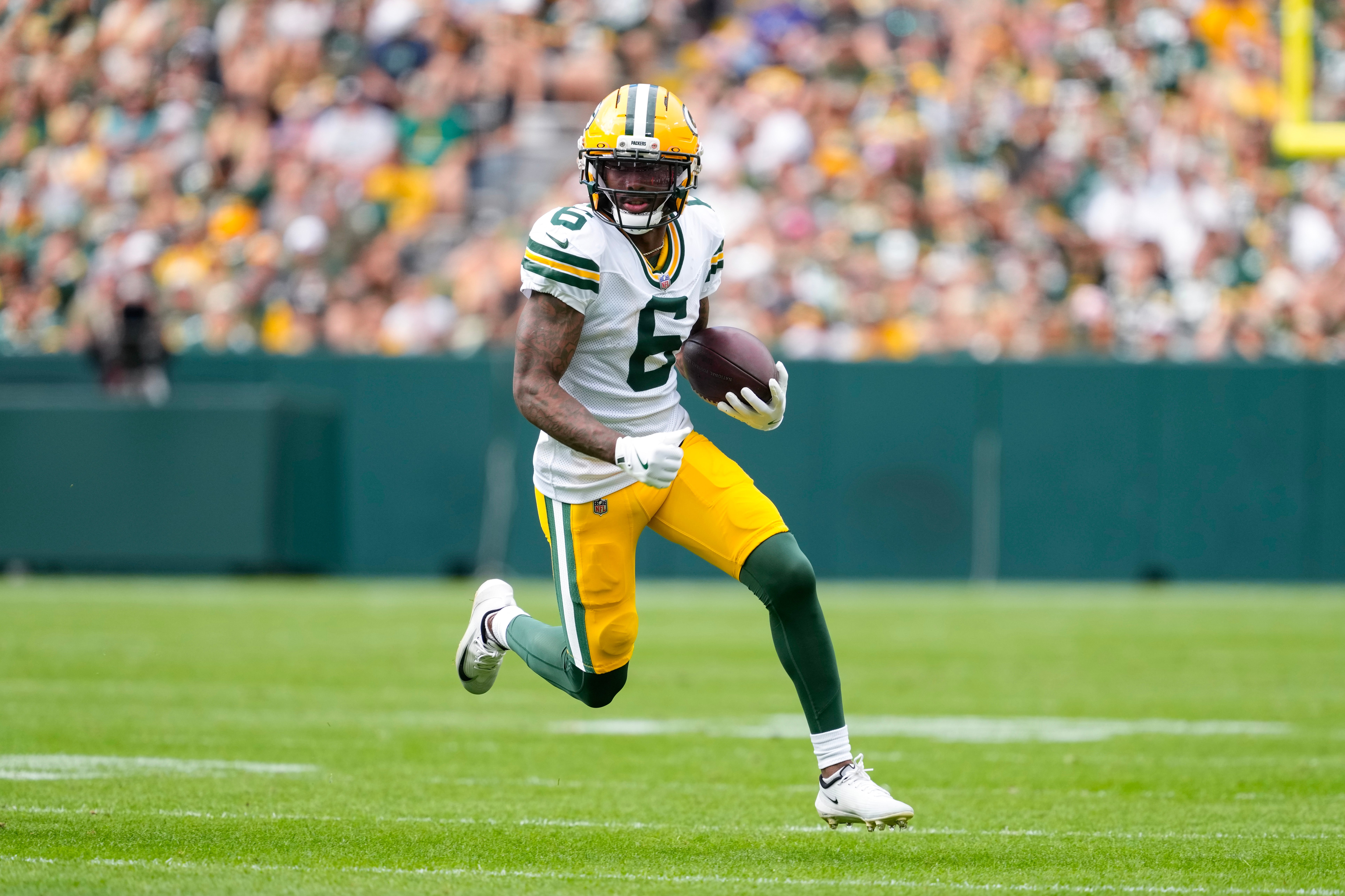 Aug 23, 2025; Green Bay, Wisconsin, USA; Green Bay Packers wide receiver Mecole Hardman (6) rushes with the football during the second quarter against the Seattle Seahawks at Lambeau Field.