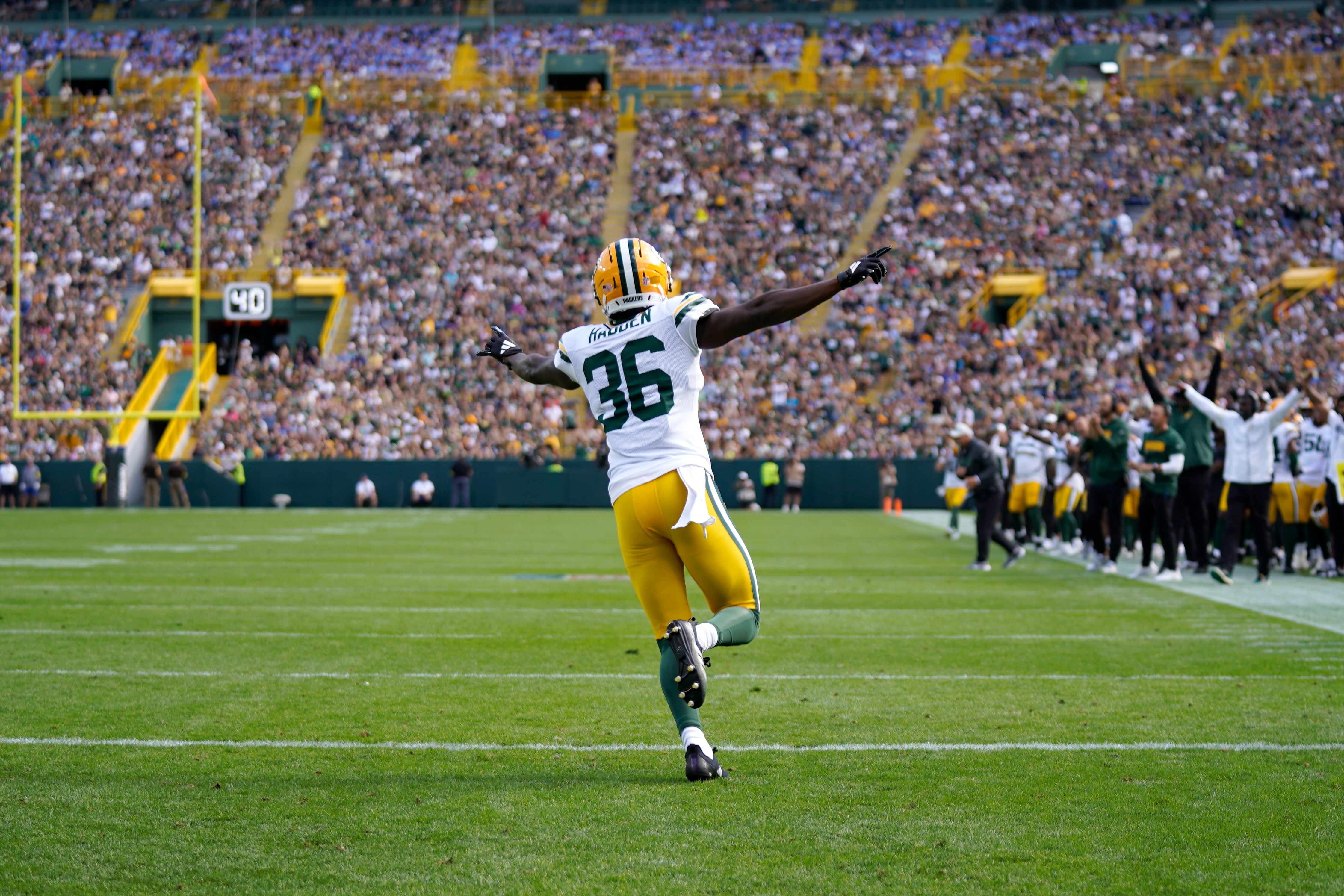 Aug 23, 2025; Green Bay, Wisconsin, USA; Green Bay Packers cornerback Kamal Hadden (36) reacts to a defensive stand preventing a Seattle Seahawks touchdown during the first half at Lambeau Field.
