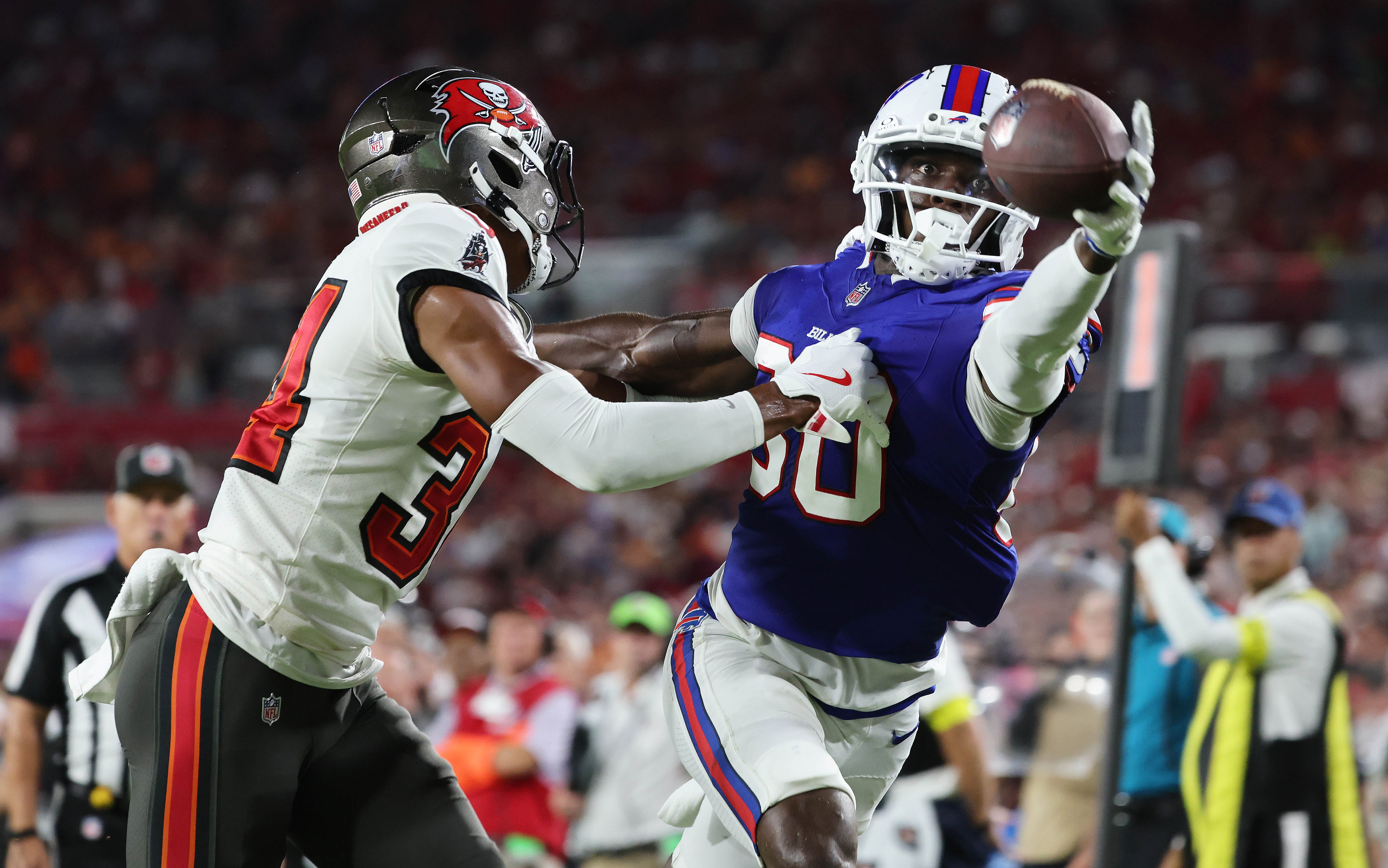 Aug 23, 2025; Tampa, Florida, USA; Buffalo Bills wide receiver Tyrell Shavers (80) catches the ball over Tampa Bay Buccaneers cornerback Bryce Hall (34) for a touchdown during the second quarter at Raymond James Stadium.