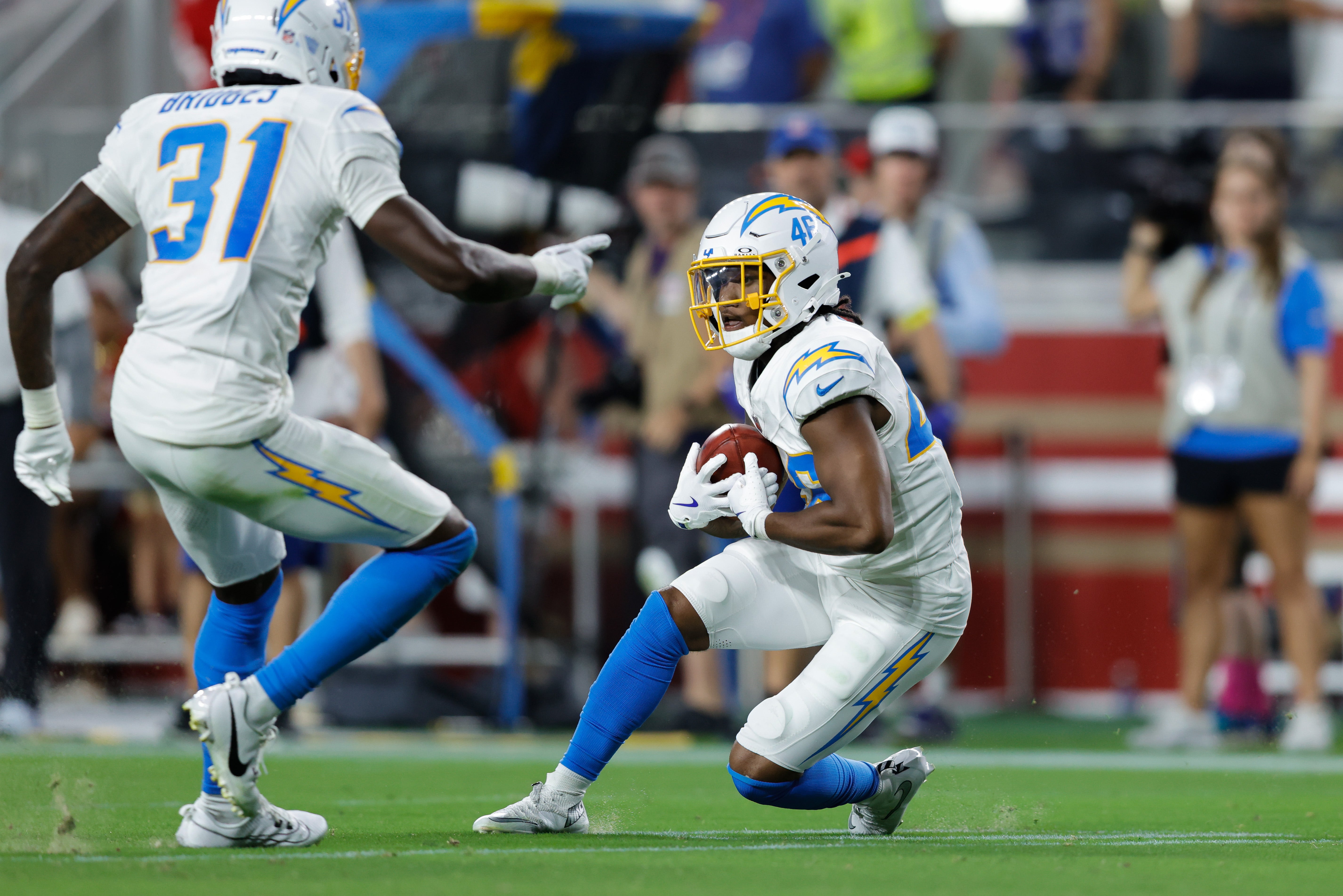 Aug 23, 2025; Santa Clara, California, USA; Los Angeles Chargers cornerback Nikko Reed (46) recovers a fumble by San Francisco 49ers wide receiver Junior Bergen (not pictured) during the fourth quarter at Levi's Stadium. Mandatory Credit: Sergio Estrada-Imagn Images