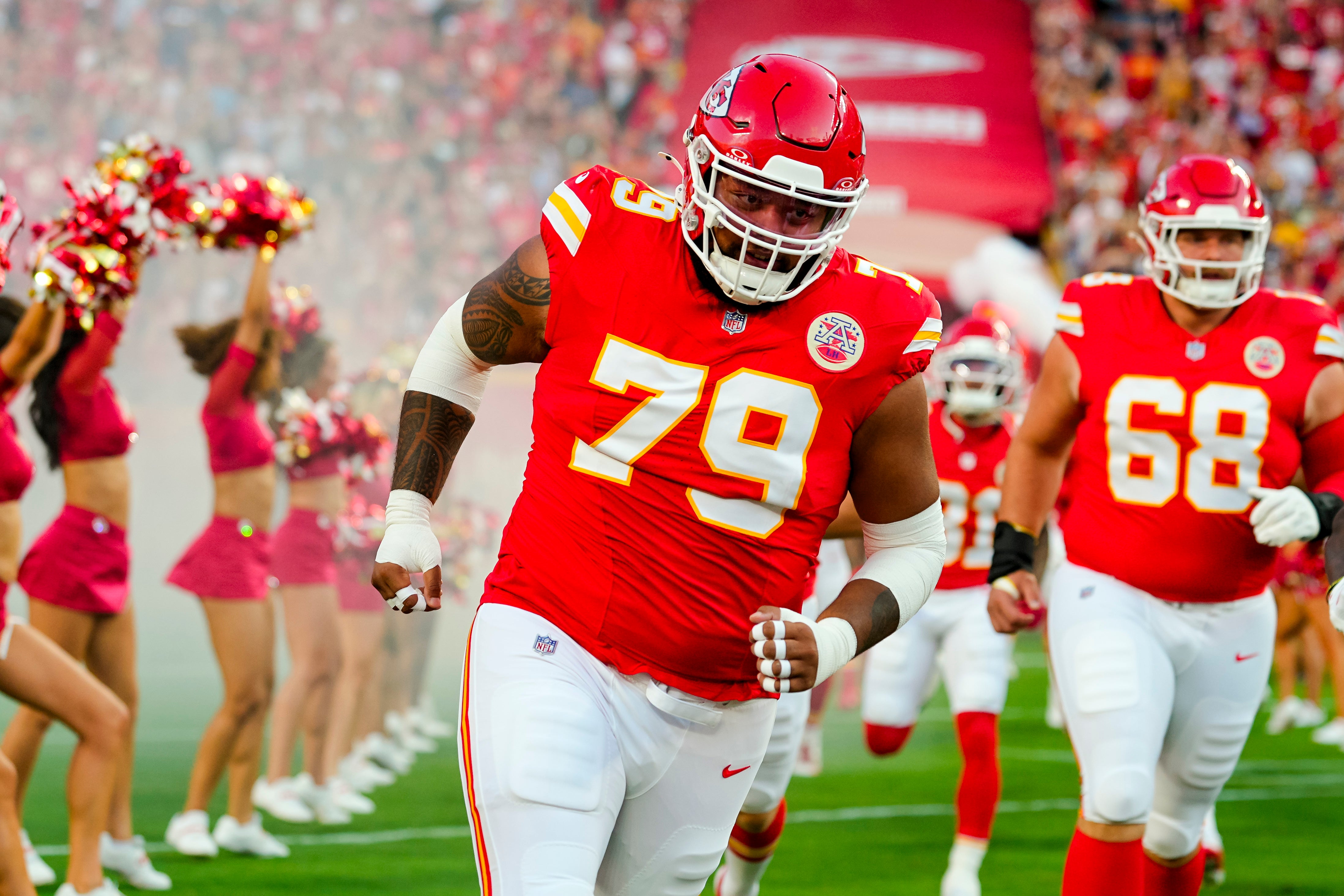 Aug 22, 2025; Kansas City, Missouri, USA; Kansas City Chiefs offensive tackle Esa Pole (79) takes the field prior to a game against the Chicago Bears at GEHA Field at Arrowhead Stadium.