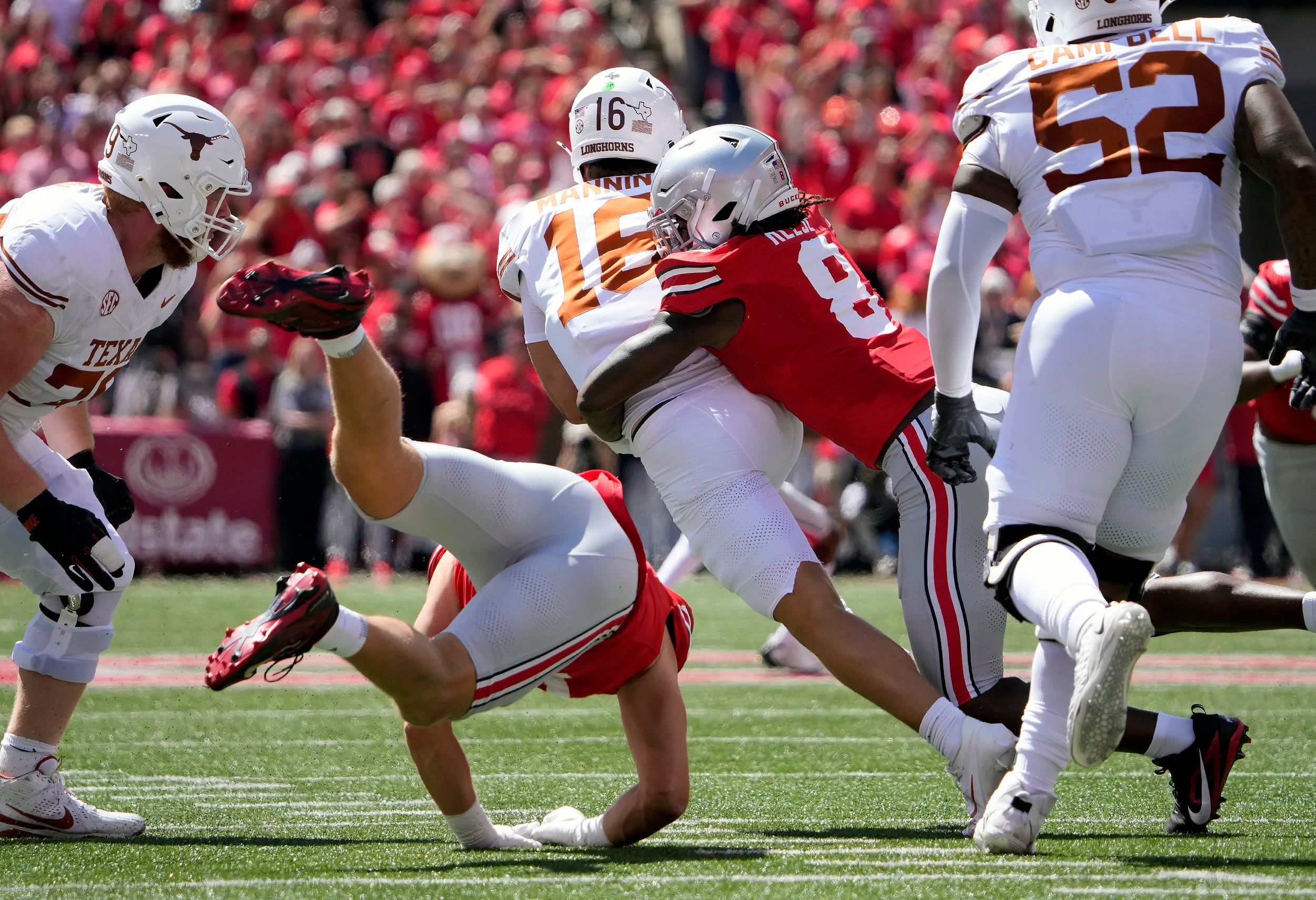Aug 30, 2025; Columbus, Ohio, USA; Texas Longhorns quarterback Arch Manning (16) drops back to pass against the Ohio State Buckeyes in the first half at Ohio Stadium.