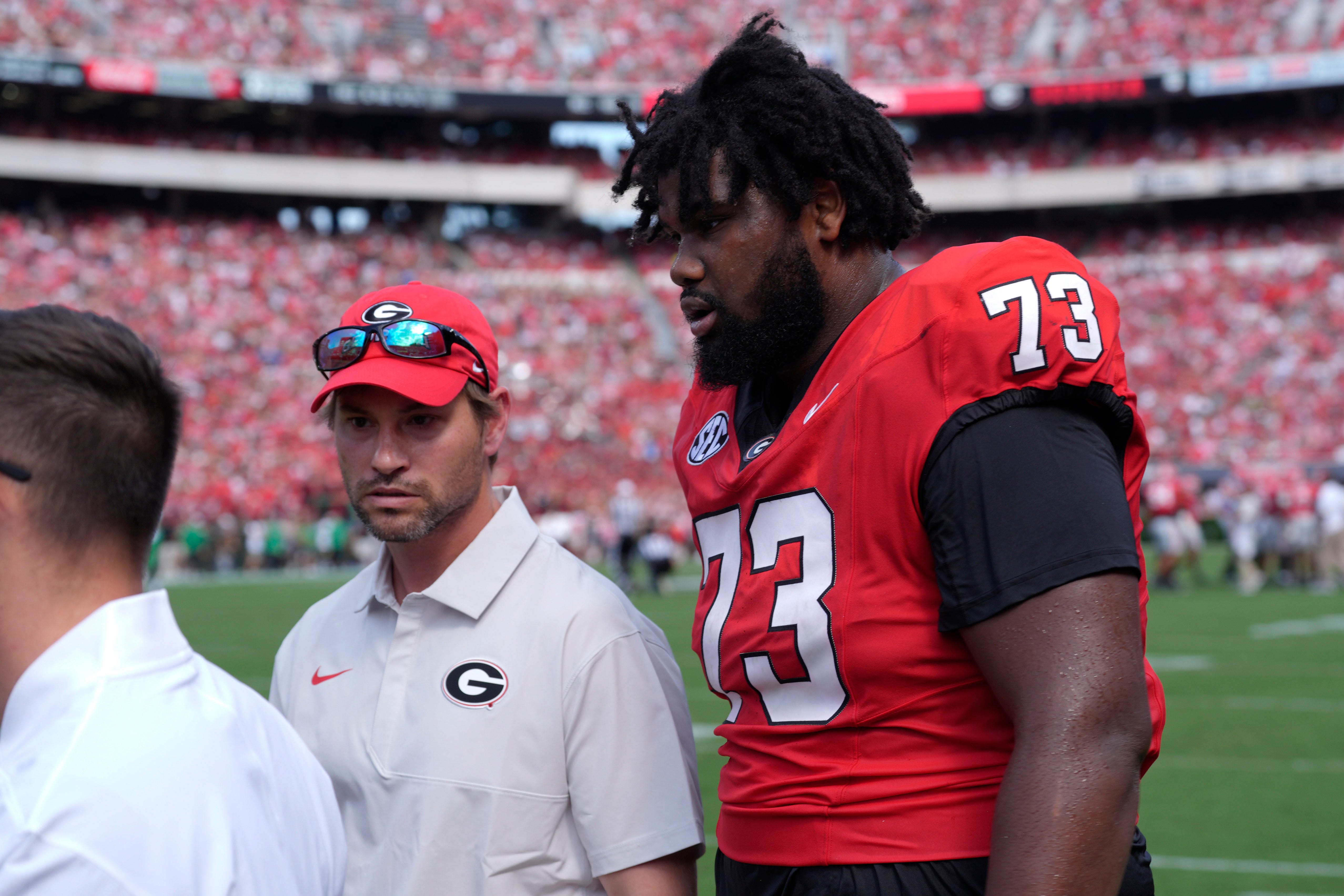 Georgia offensive lineman Juan Gaston (73) leaves the field after going down during the first half of a NCAA college football game against Marshall in Athens, Ga., on Saturday, August. 30, 2025 Joshua L. Jones-USA TODAY NETWORK via Imagn Images