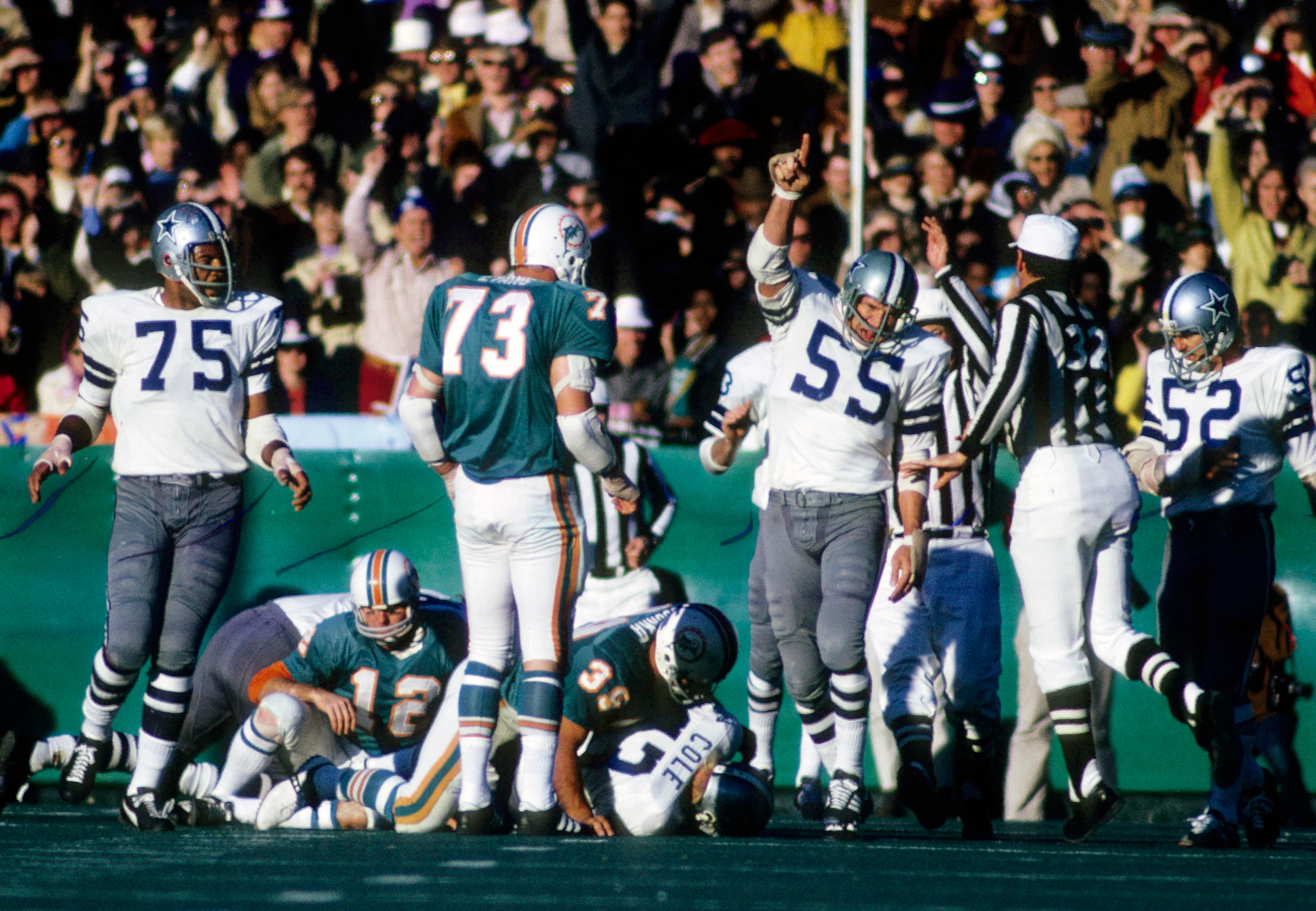 Jan 16, 1972; New Orleans, LA, USA; FILE PHOTO; Dallas Cowboys linebacker Lee Roy Jordan (55) and Jethro Pugh (75) react after recovering a fumble against the Miami Dolphins during Super Bowl VI at Tulane Stadium. The Cowboys defeated the Dolphins 24-3.