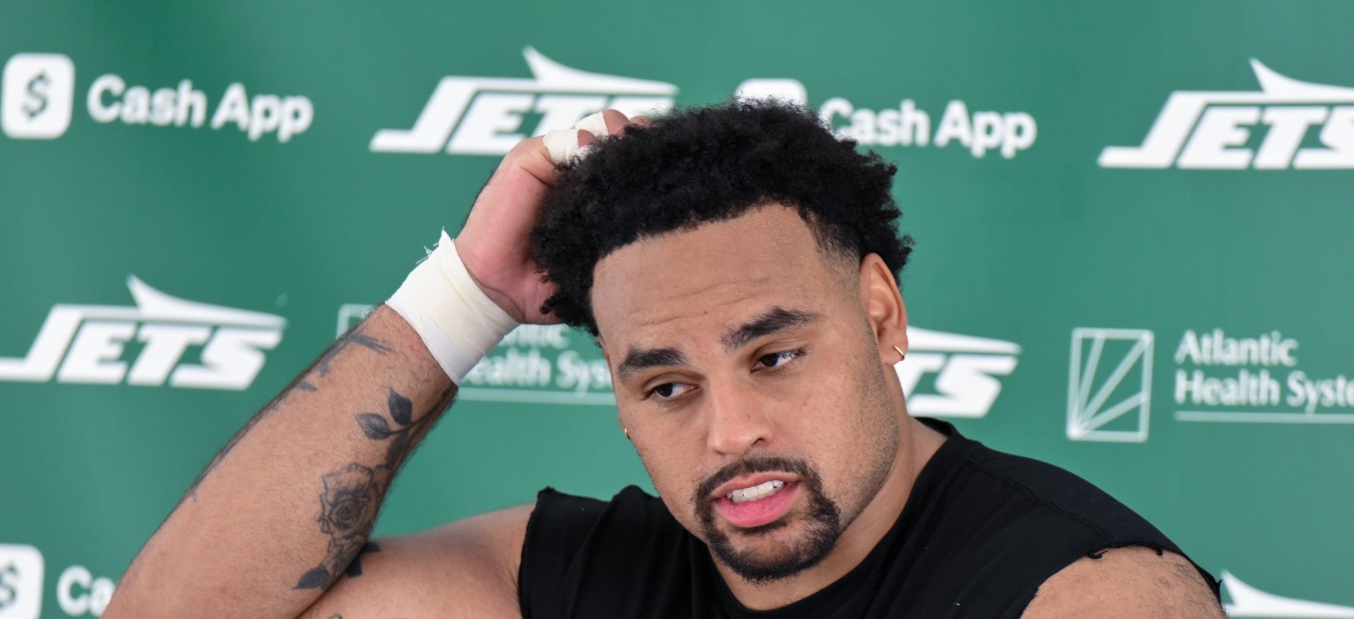 Jul 24, 2025; Florham Park, NY, USA; New York Jets guard Alijah Vera-Tucker (75) speaks to the media during training camp at Atlantic Health Jets Training Center