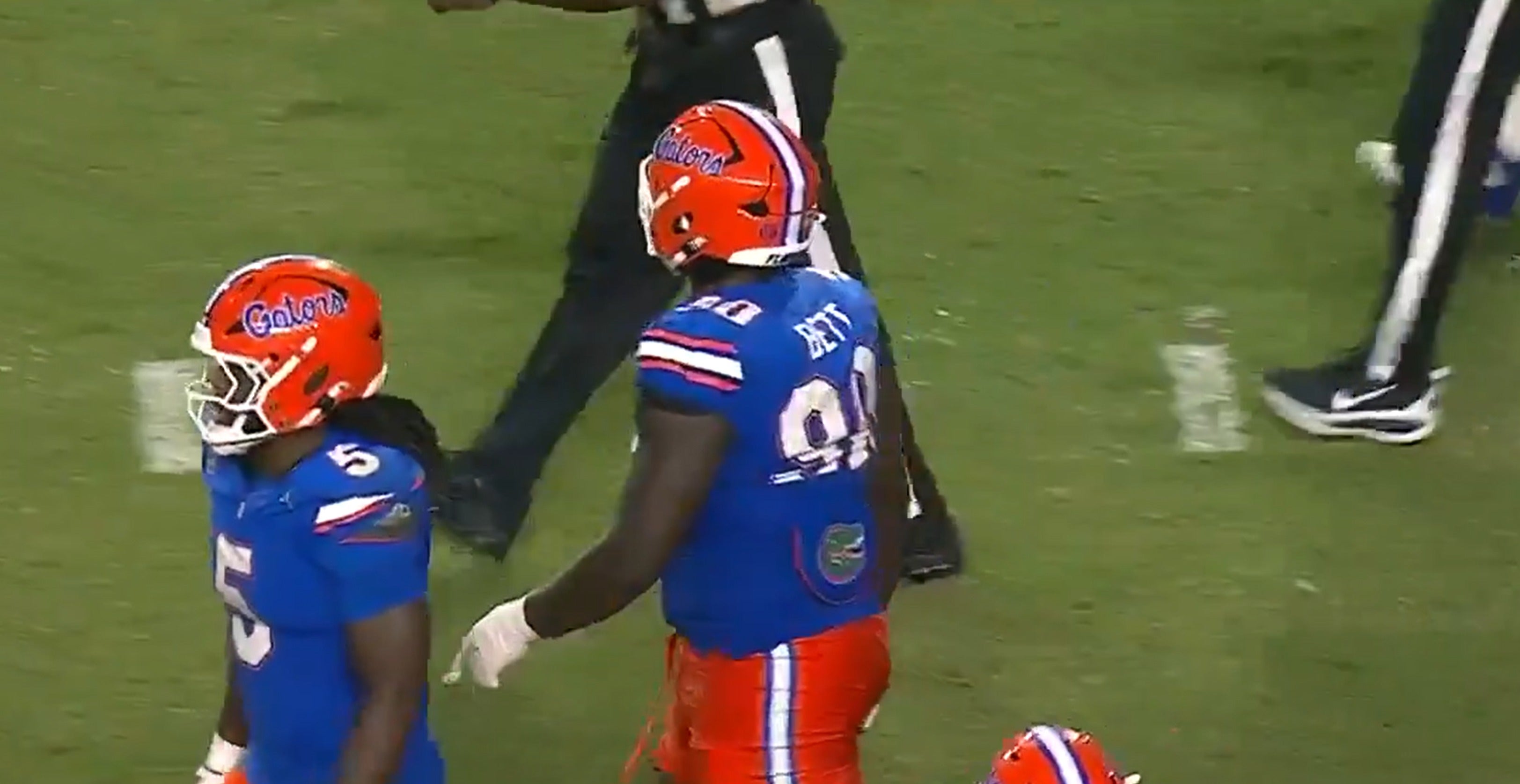 Florida Gators defensive tackle Brendan Bett (90) gets ejected after spitting on a South Florida defender.