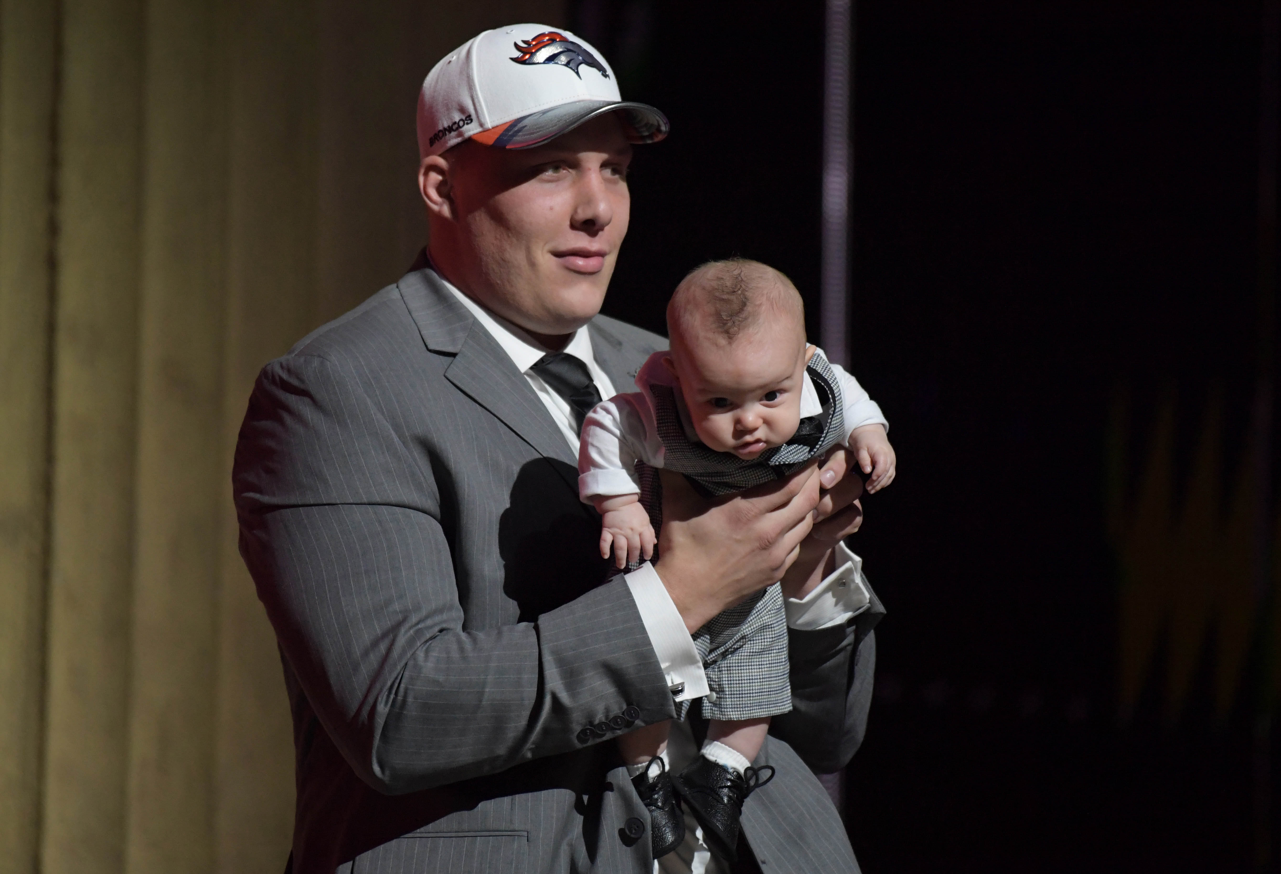 Apr 27, 2017; Philadelphia, PA, USA; Utah Utes offensive tackle Garrett Bolles poses with his 4-month-old son Kingston Bolles after being selected as the number 20 overall pick by the Denver Broncos in the first round the 2017 NFL Draft at the Philadelphia Museum of Art.
