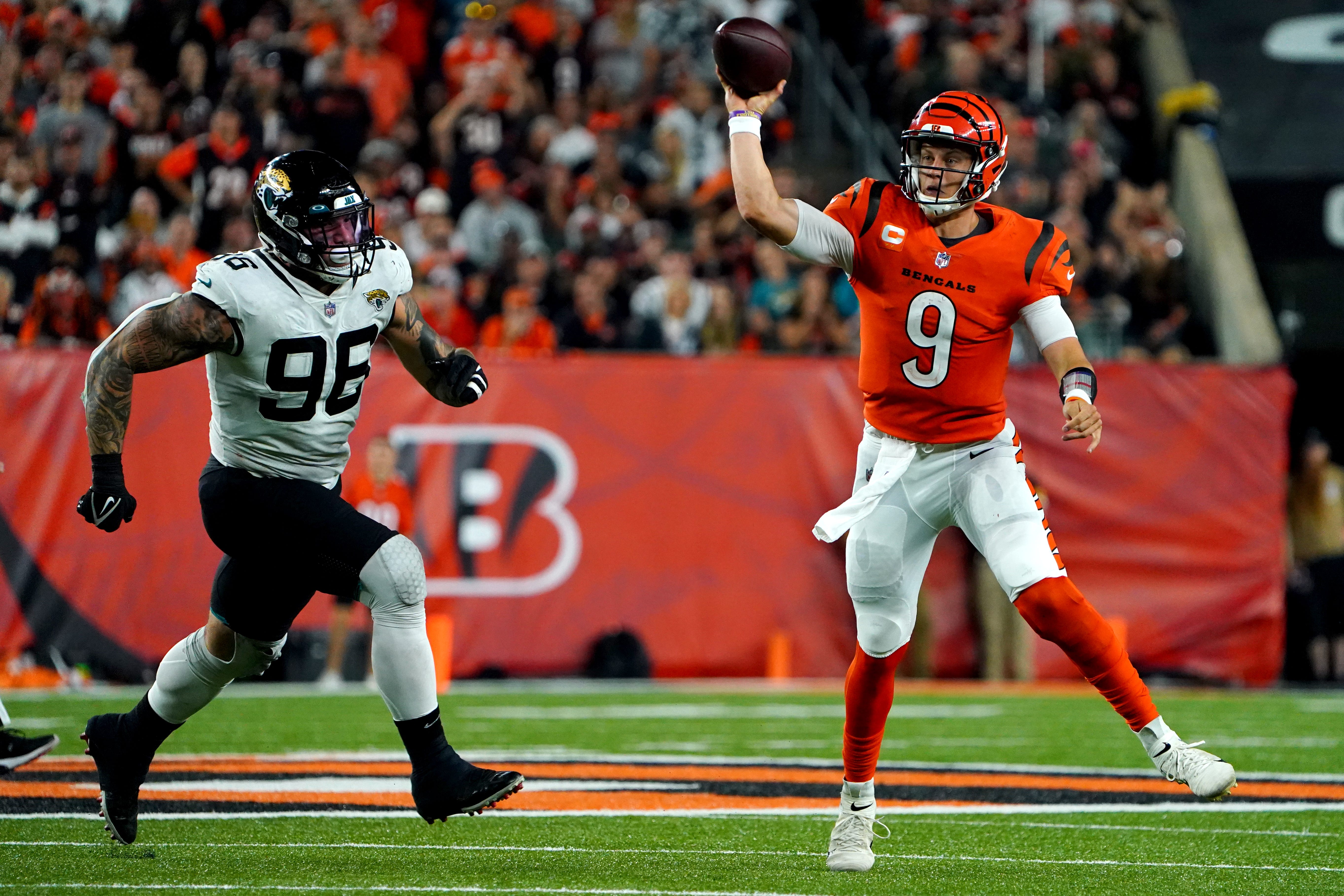 Cincinnati Bengals quarterback Joe Burrow (9) throws a touchdown pass to Cincinnati Bengals tight end C.J. Uzomah (87) (not pictured) in the fourth quarter during a Week 4 NFL football game against the Jacksonville Jaguars, Thursday, Sept. 30, 2021, at Paul Brown Stadium in Cincinnati.