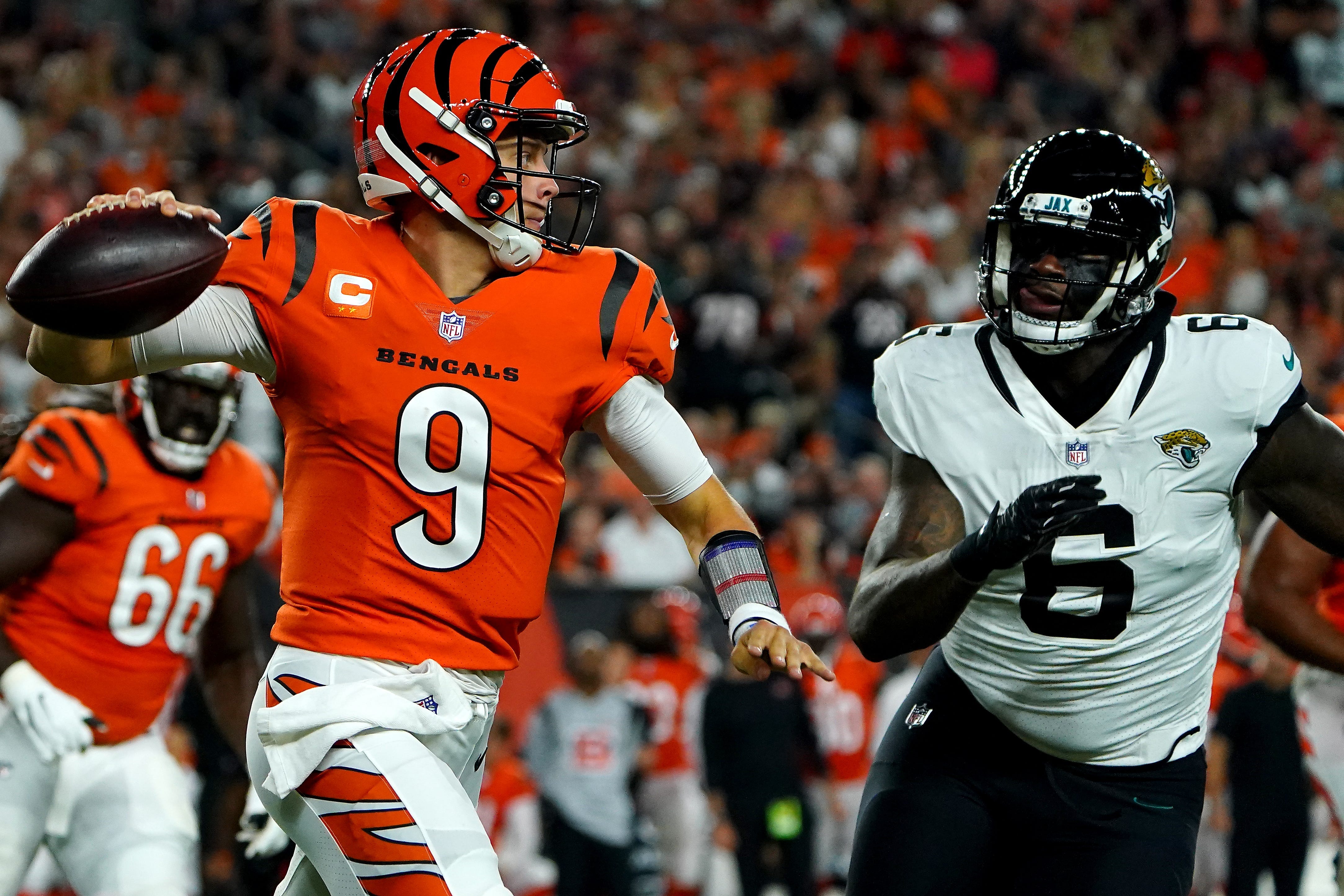 Cincinnati Bengals quarterback Joe Burrow (9) throws a pass against the Jacksonville Jaguars on Sept. 30, 2021.