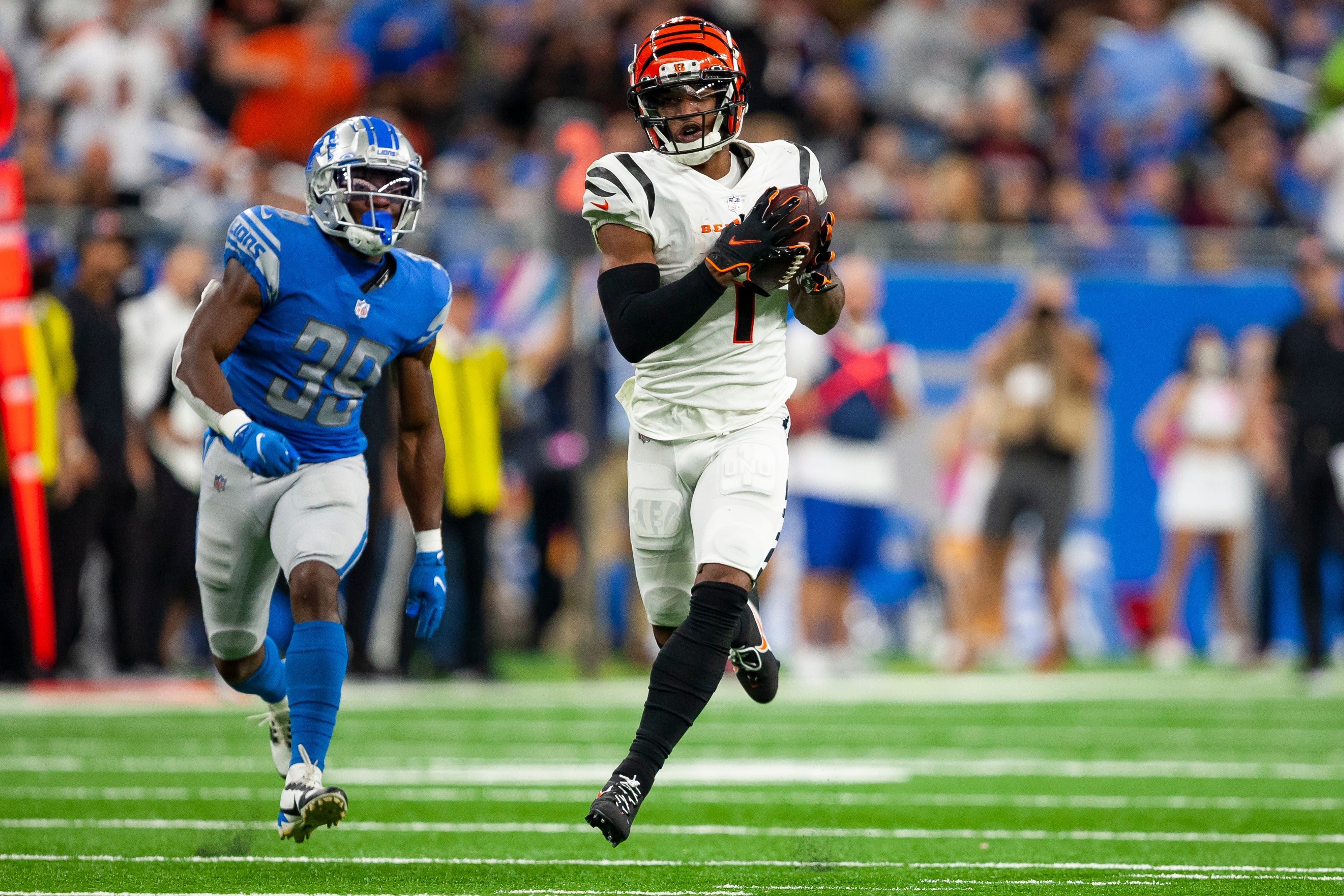 Oct 17, 2021; Detroit, Michigan, USA; Cincinnati Bengals wide receiver Ja'Marr Chase (1) makes a catch against Detroit Lions cornerback Jerry Jacobs (39) during the third quarter at Ford Field.