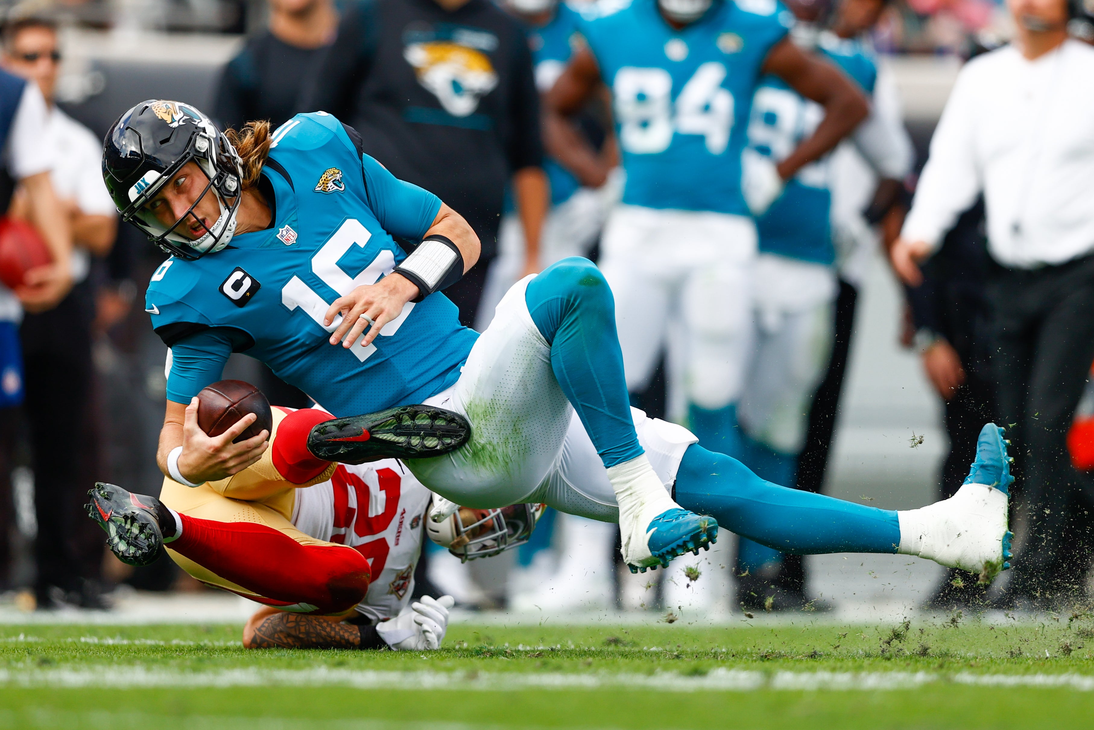 Nov 21, 2021; Jacksonville, Florida, USA; Jacksonville Jaguars quarterback Trevor Lawrence (16) is tacked by San Francisco 49ers safety Talanoa Hufanga (29) in the first half at TIAA Bank Field.
