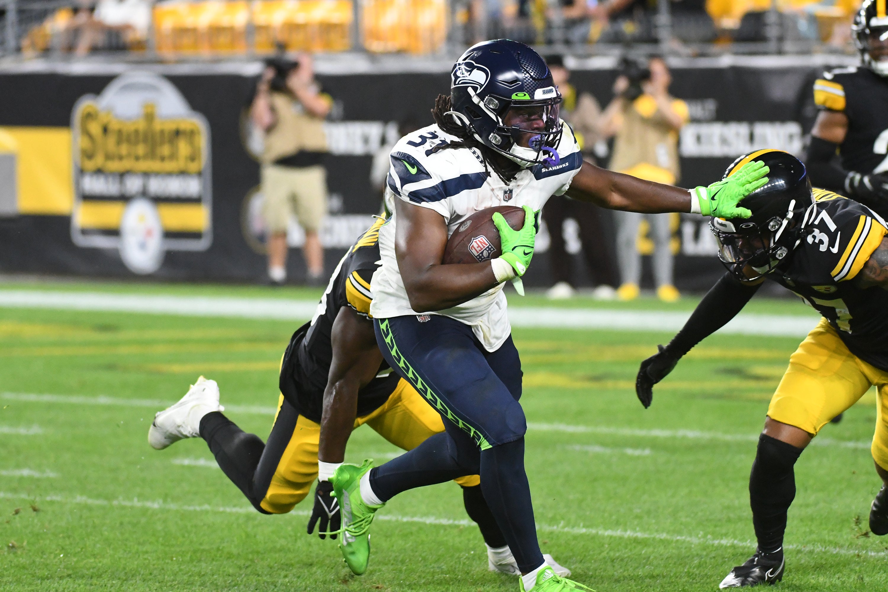 Aug 13, 2022; Pittsburgh, Pennsylvania, USA; Seattle Seahawks running back DeeJay Dallas (31) runs against the Pittsburgh Steelers at Acrisure Stadium.