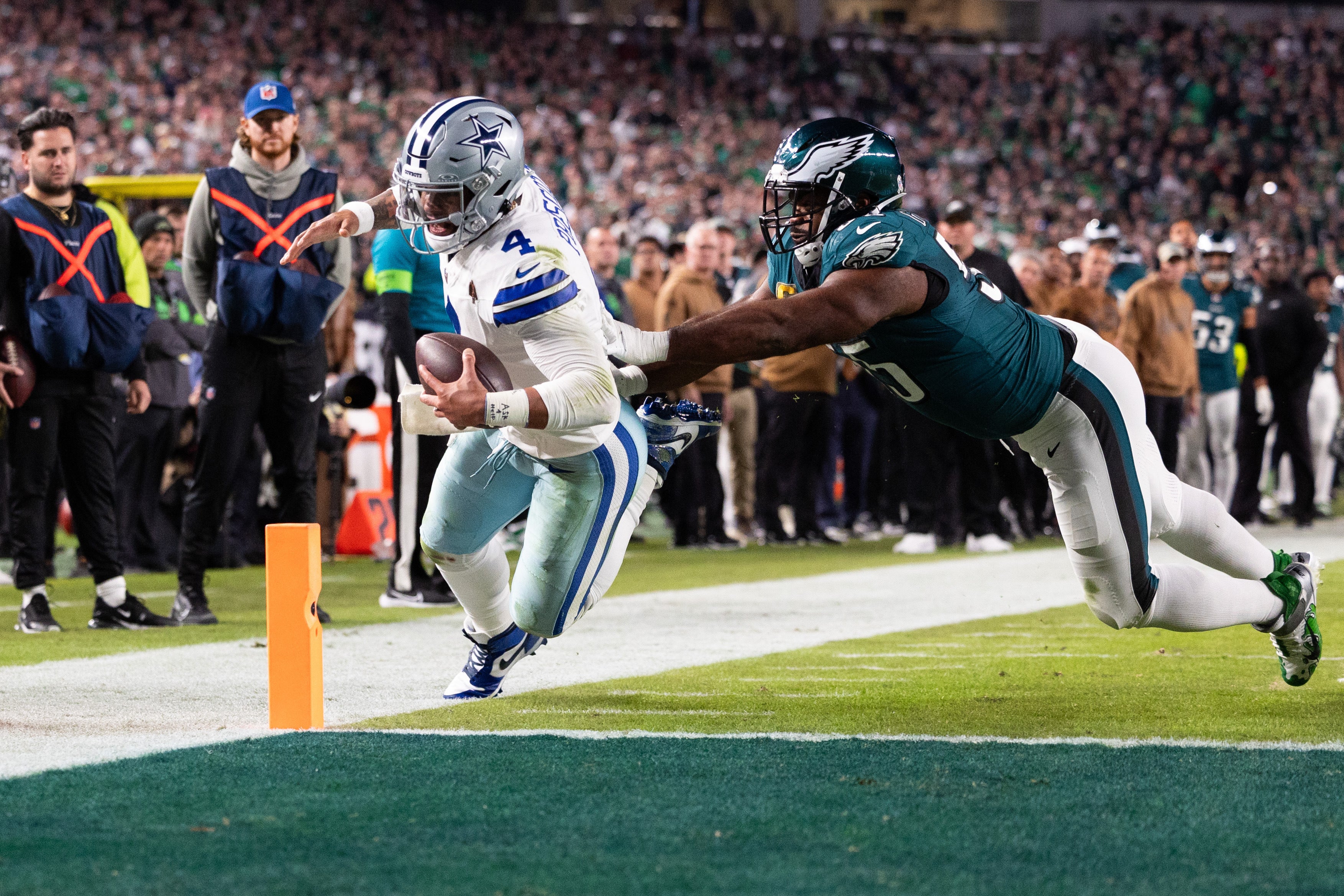 Philadelphia Eagles defensive end Brandon Graham (55) pushes Dallas Cowboys quarterback Dak Prescott (4) out of bounds short of a two point conversion during the fourth quarter at Lincoln Financial Field.