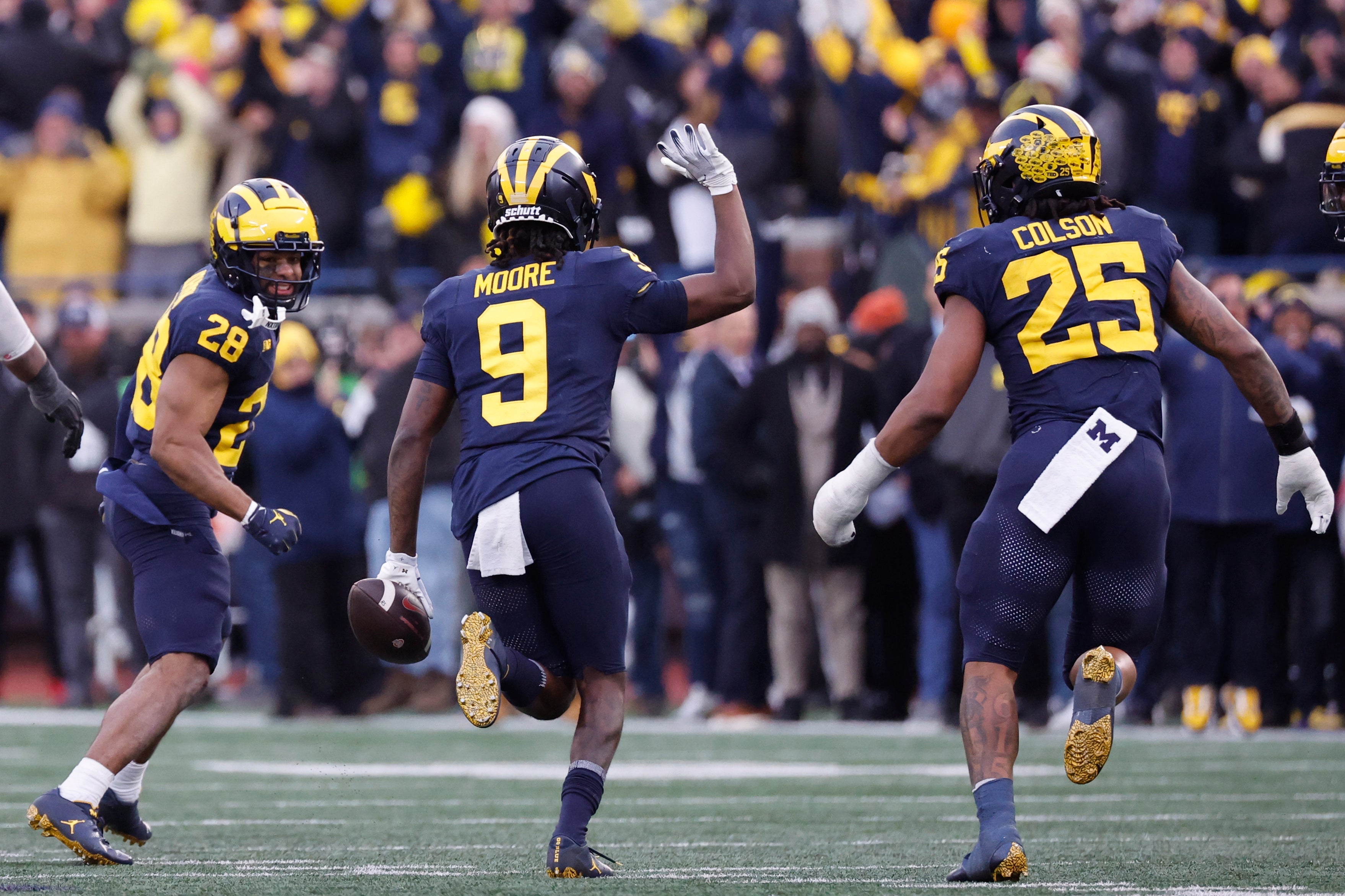 Nov 25, 2023; Ann Arbor, Michigan, USA; Michigan Wolverines defensive back Rod Moore (9) celebrates after he makes an interception in the second half against the Ohio State Buckeyes at Michigan Stadium.