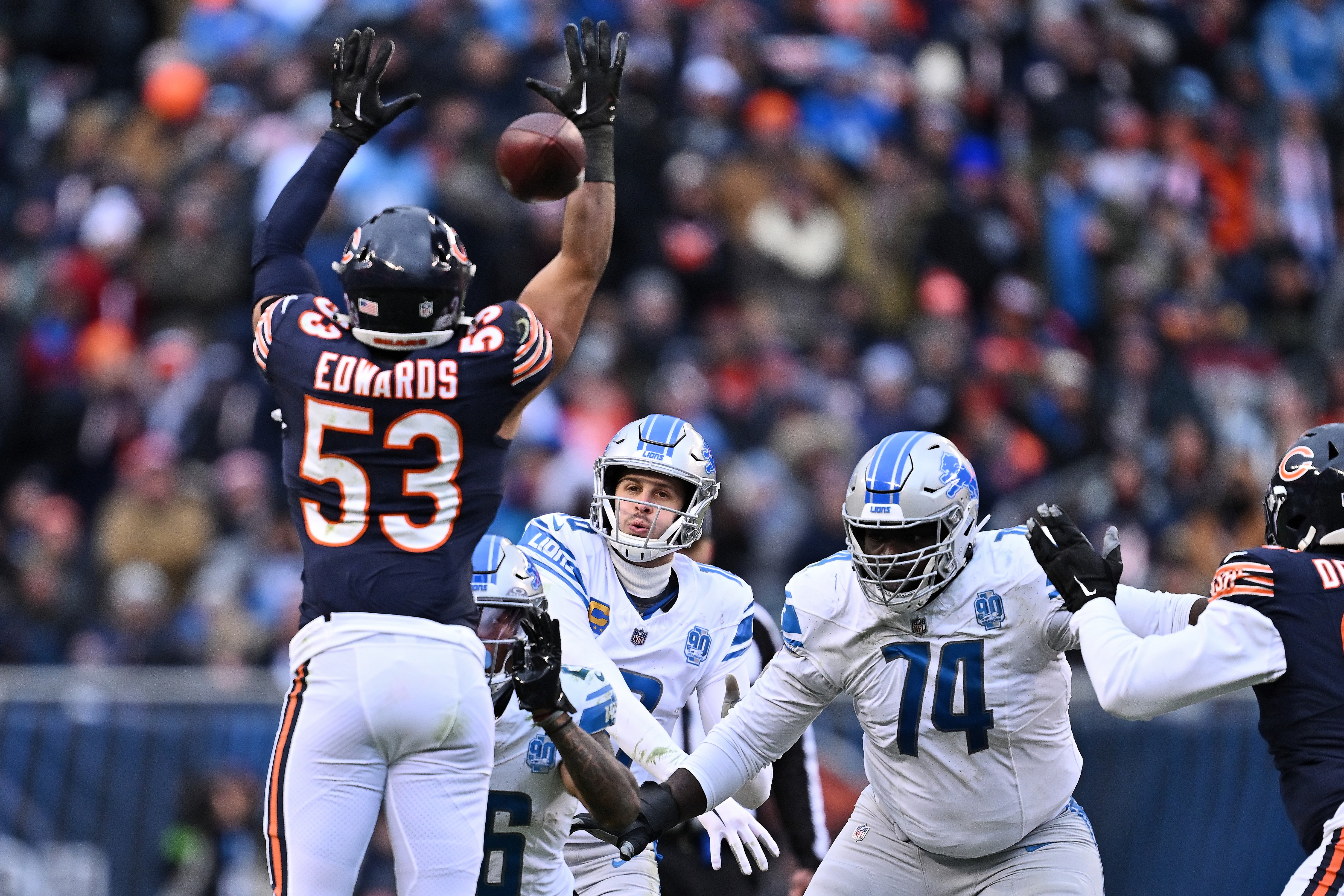 Dec 10, 2023; Chicago, Illinois, USA; Detroit Lions quarterback Jared Goff (16) throws through the defense of Chicago Bears linebacker T.J. Edwards (53) in the second half at Soldier Field.