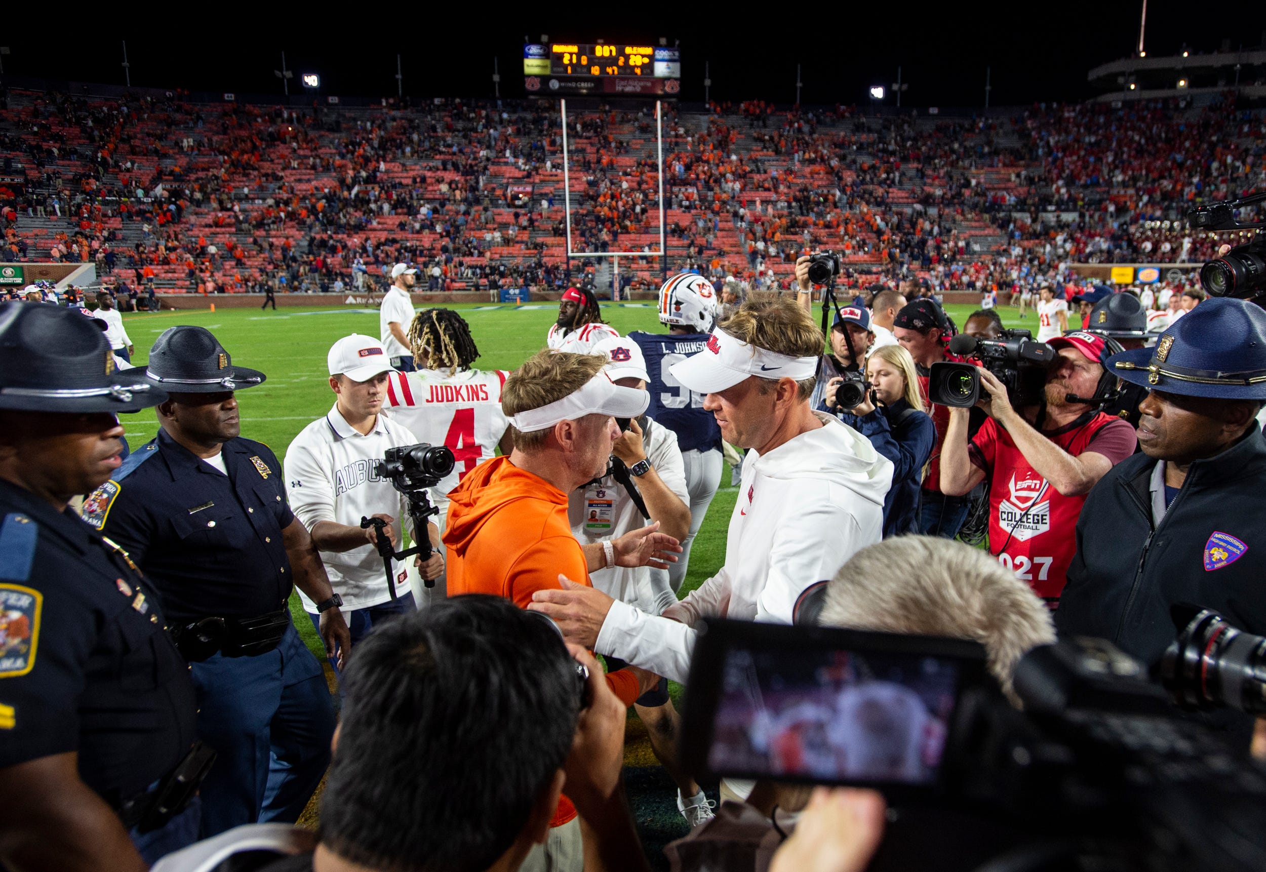 Auburn Tigers head coach Hugh Freeze and Mississippi Rebels head coach Lane Kiffin shake hands after the game as Auburn Tigers take on Mississippi Rebels at Jordan-Hare Stadium in Auburn, Ala., on Saturday, Oct. 21, 2023. Mississippi Rebels defeated Auburn Tigers 28-21.