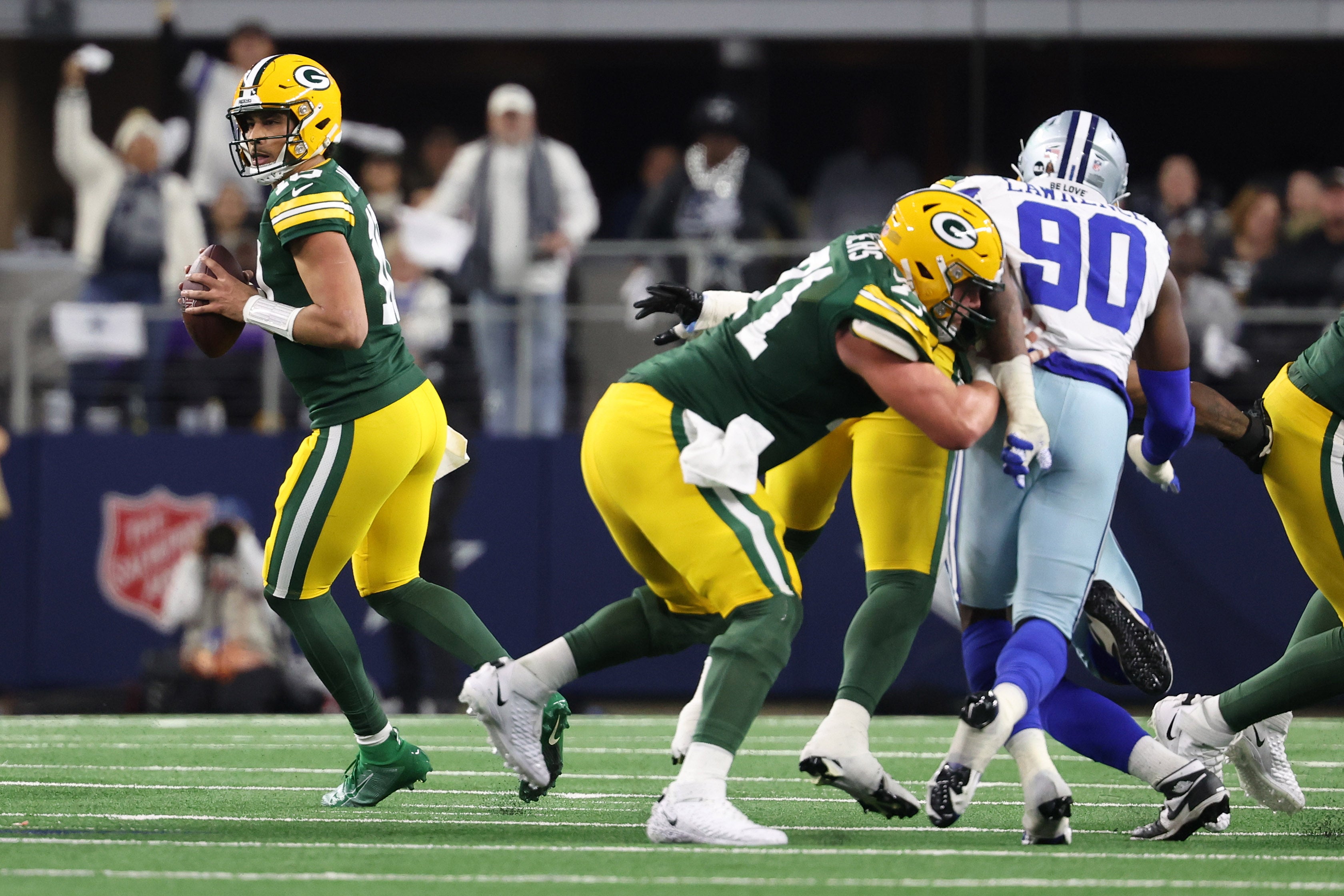 Jan 14, 2024; Arlington, Texas, USA; Green Bay Packers quarterback Jordan Love (10) drops back to pass against the Dallas Cowboys in the first half of the 2024 NFC wild card game at AT&T Stadium.