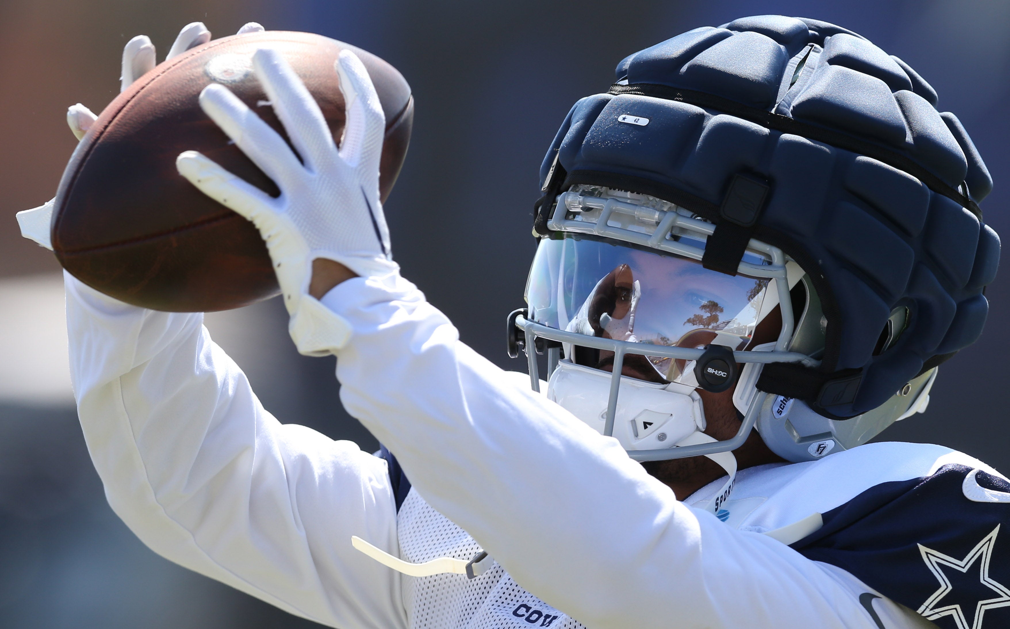 Jul 31, 2024; Oxnard, CA, USA; Dallas Cowboys running back Deuce Vaughn (42) makes a catch during training camp at the River Ridge Playing Fields in Oxnard, California.