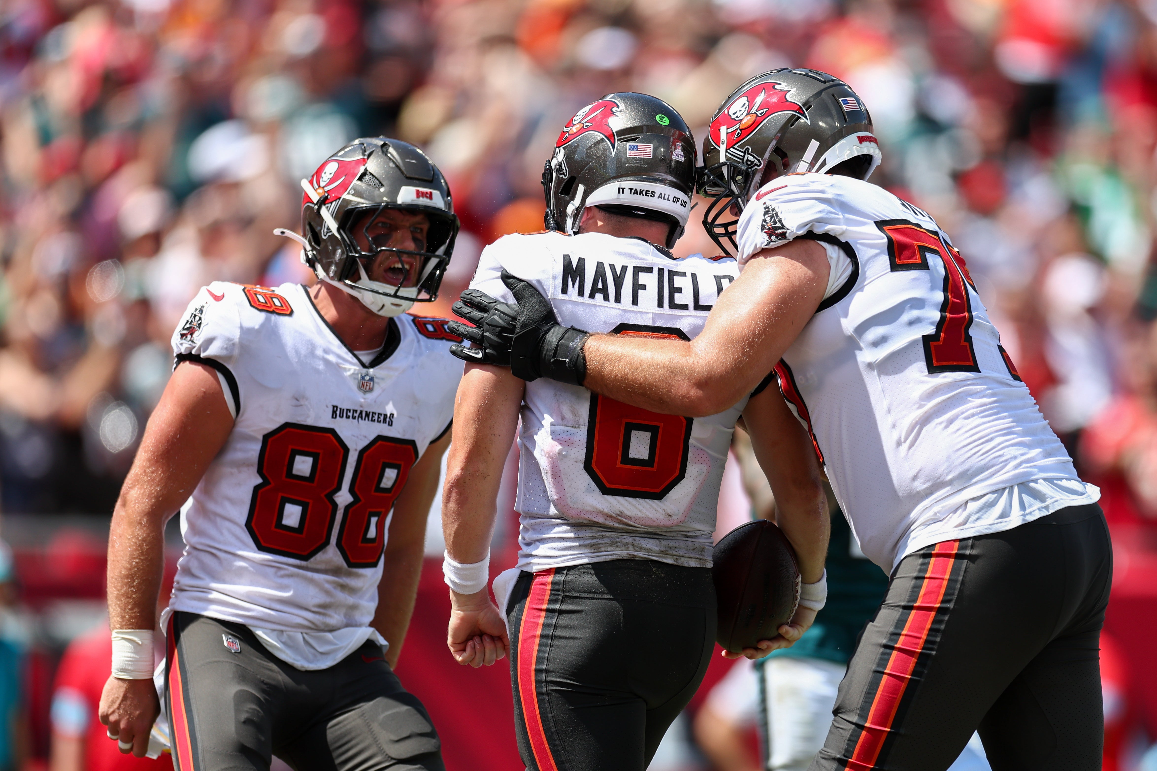 Sep 29, 2024; Tampa, Florida, USA; Tampa Bay Buccaneers tight end Cade Otton (88) congratulates quarterback Baker Mayfield (6) after a touchdown against the Philadelphia Eagles in the second quarter at Raymond James Stadium.