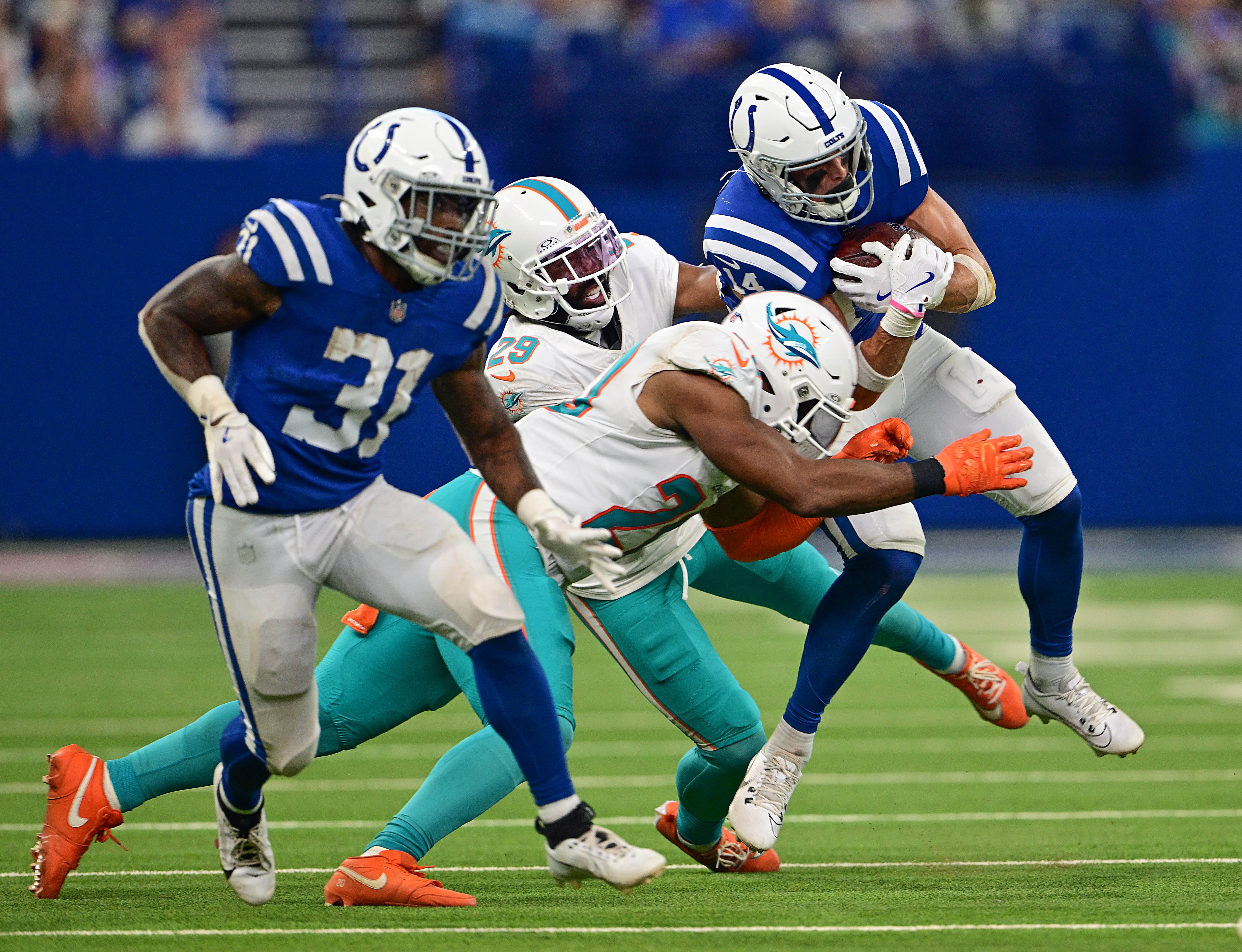 Colts WR Alec Pierce trying to break a tackle while RB Tyler Goodson blocks
