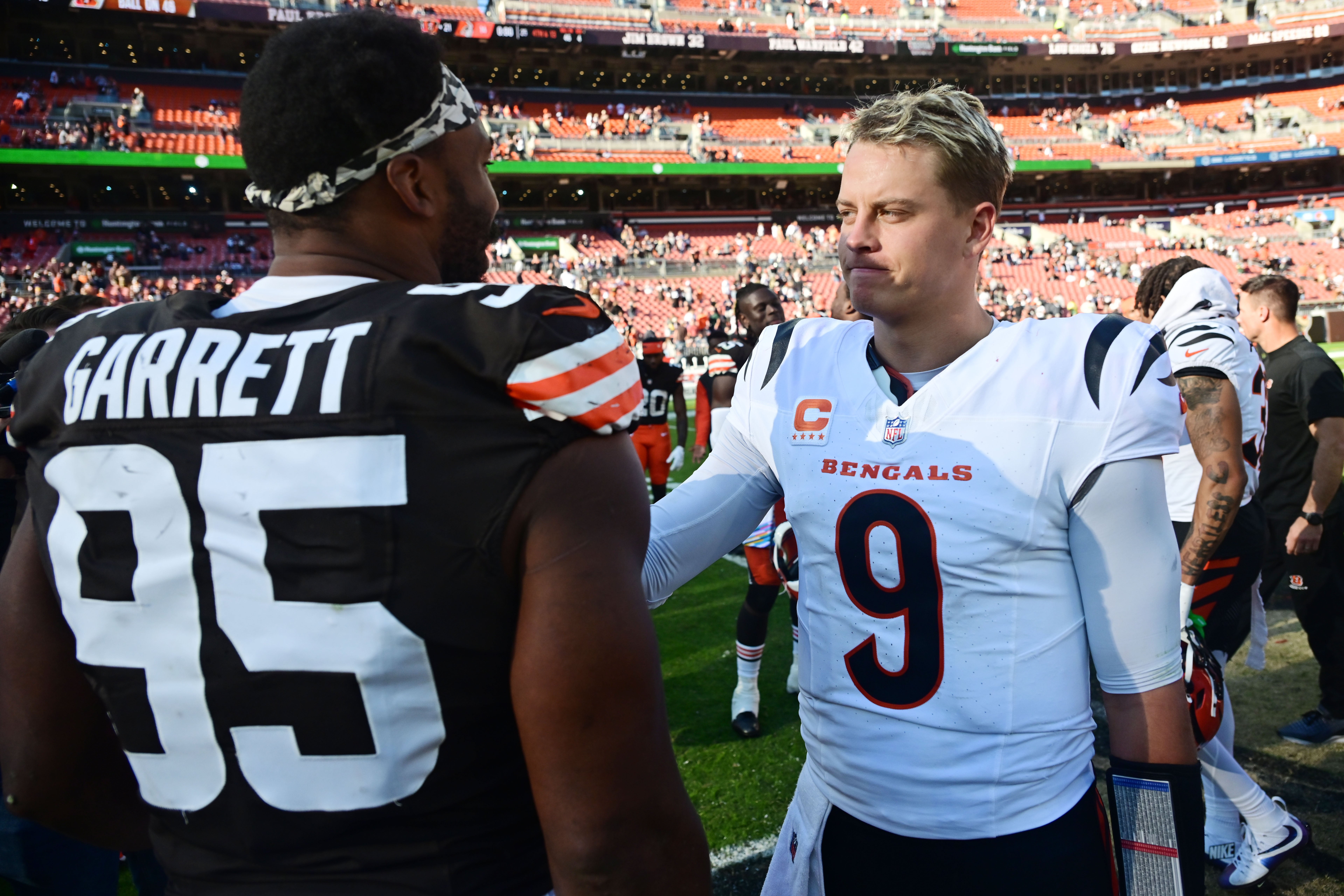 Oct 20, 2024; Cleveland, Ohio, USA; Cincinnati Bengals quarterback Joe Burrow (9) and Cleveland Browns defensive end Myles Garrett (95) talk after the game at Huntington Bank Field.