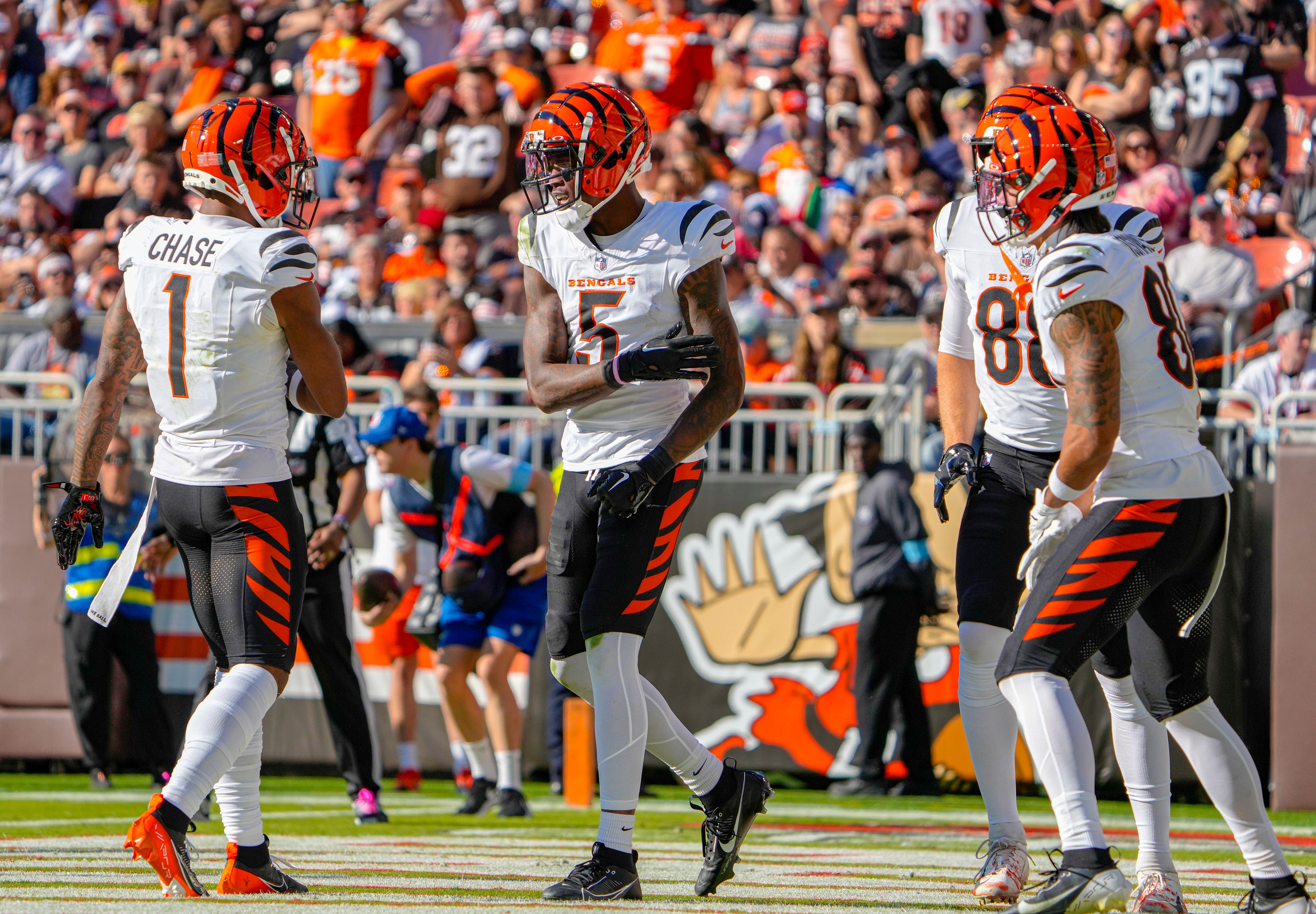 Cincinnati Bengals wide receiver Ja'Marr Chase (1), left, and Cincinnati Bengals wide receiver Tee Higgins (5) celebrate Higgins’ touchdown over the Cleveland Browns at Huntington Bank Field in Cleveland October 20, 2024. The Bengals won 21-14.
