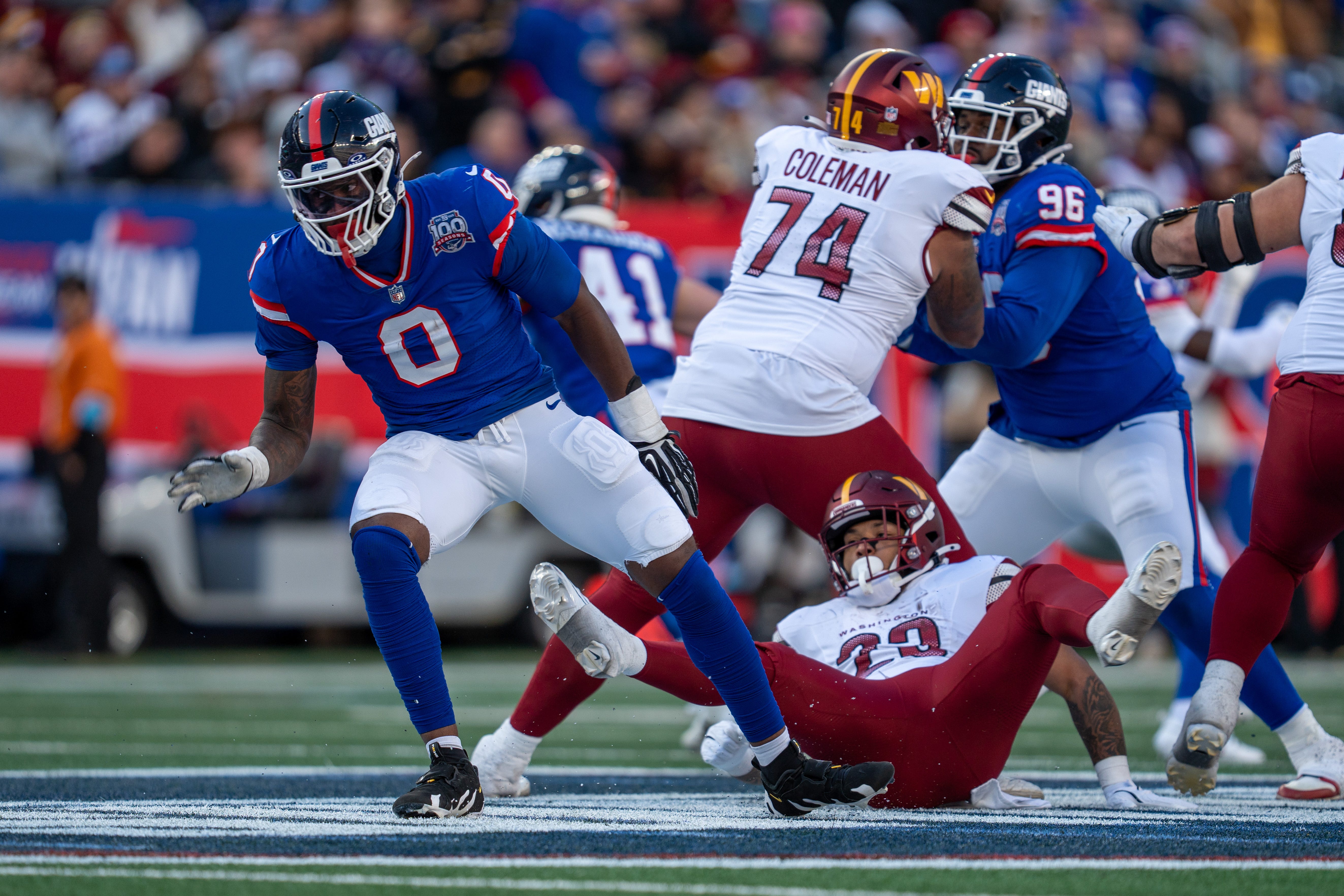 New York Giants linebacker Brian Burns (0) rushes past the offensive line during a game between the New York Giants and the Washington Commanders at MetLife Stadium in East Rutherford on Sunday, Nov. 3, 2024.