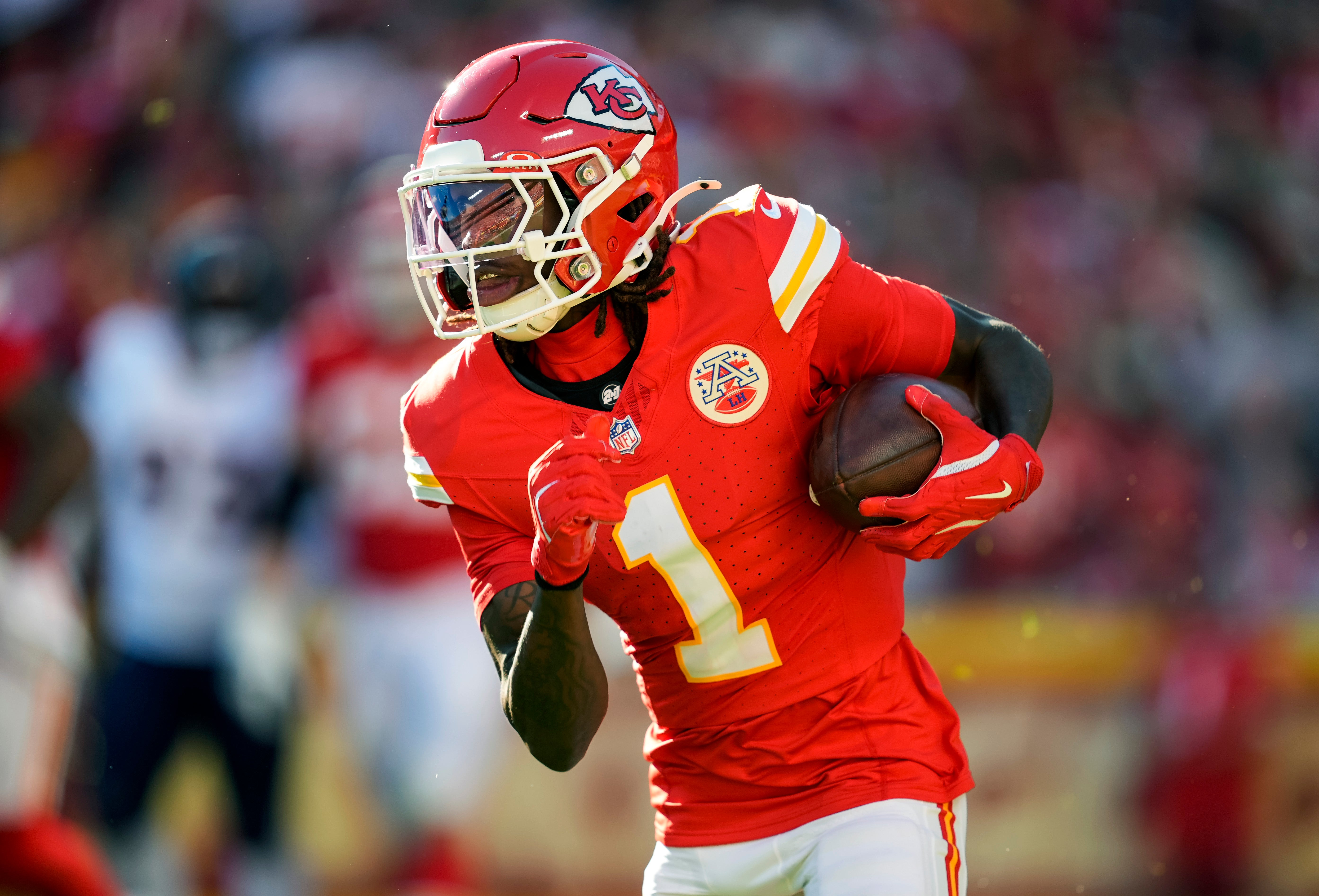 Kansas City Chiefs wide receiver Xavier Worthy (1) runs with the ball during the second half against the Denver Broncos