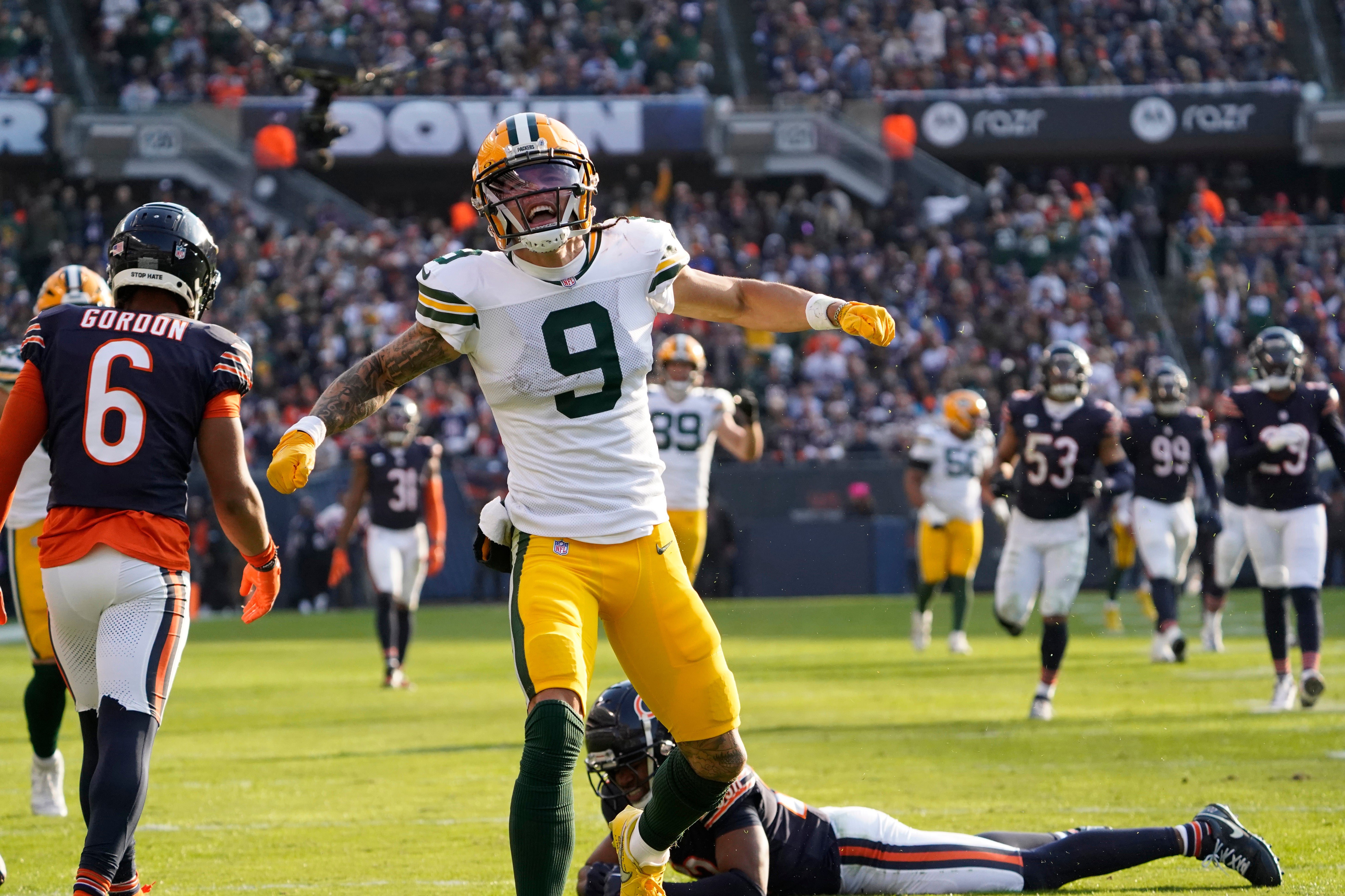 Nov 17, 2024; Chicago, Illinois, USA; Green Bay Packers wide receiver Christian Watson (9) celebrates a catch against the Chicago Bears during the second half at Soldier Field.