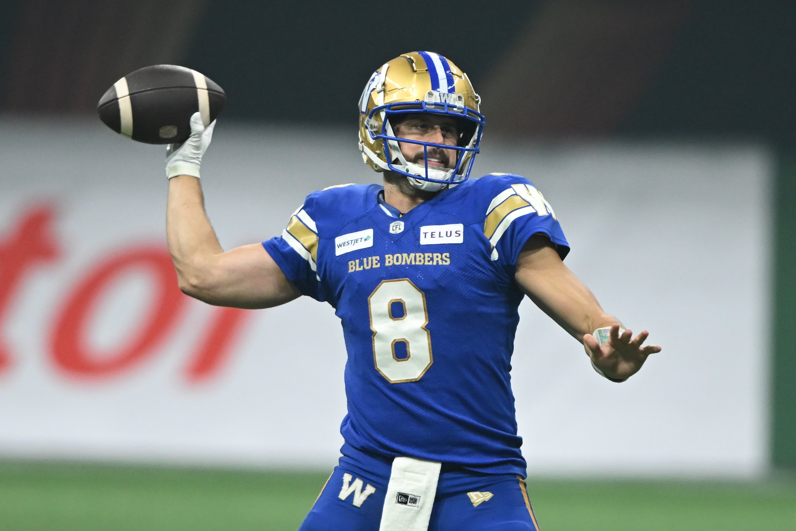 Nov 17, 2024; Vancouver, British Columbia, CAN; Winnipeg Blue Bombers quarterback Zach Collaros (8) looks to throw a pass during the fourth quarter against Toronto Argonauts at BC Place.