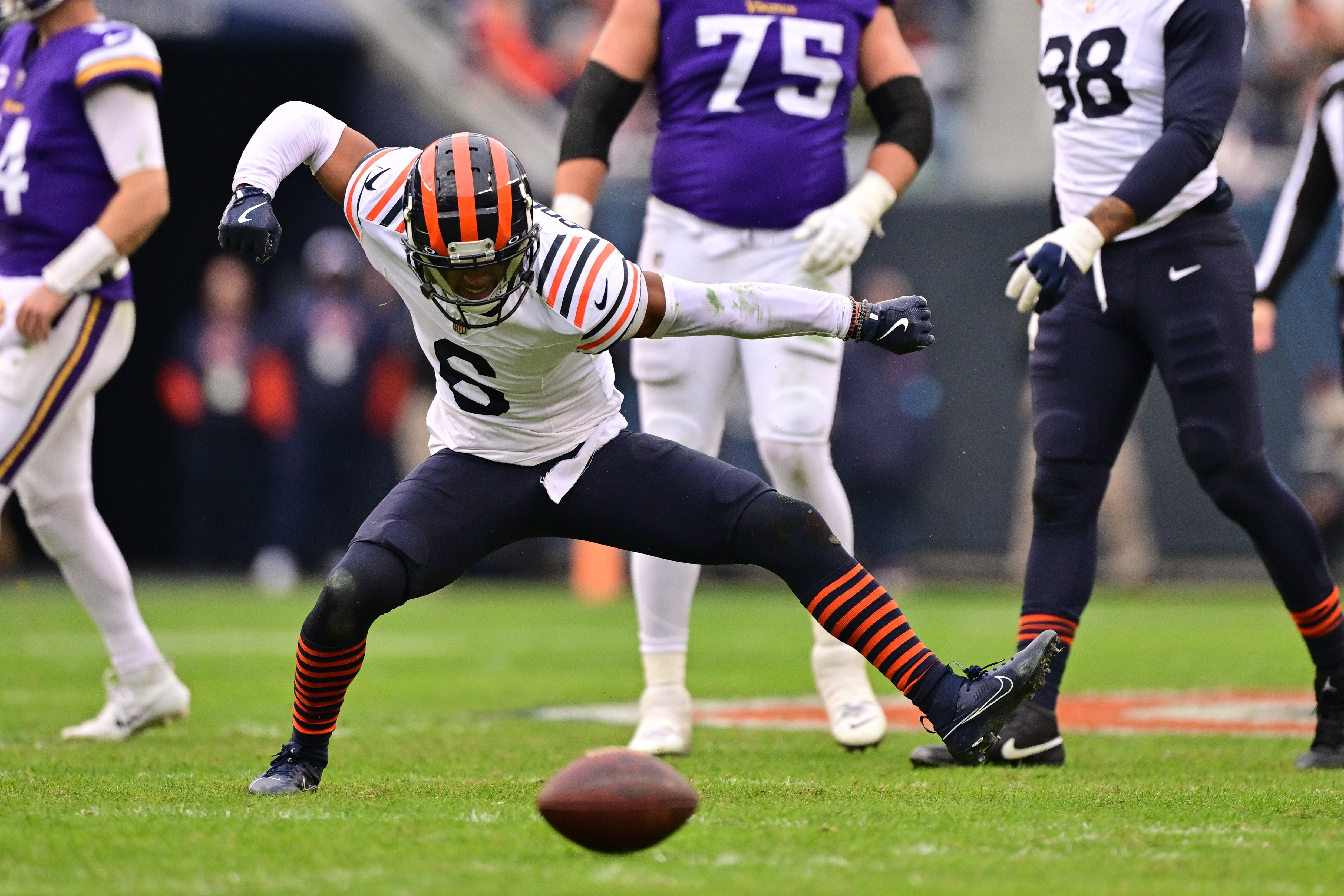 Nov 24, 2024; Chicago, Illinois, USA; Chicago Bears cornerback Kyler Gordon (6) celebrates a defensive stop on 4th down against the Minnesota Vikings during the fourth quarter at Soldier Field.