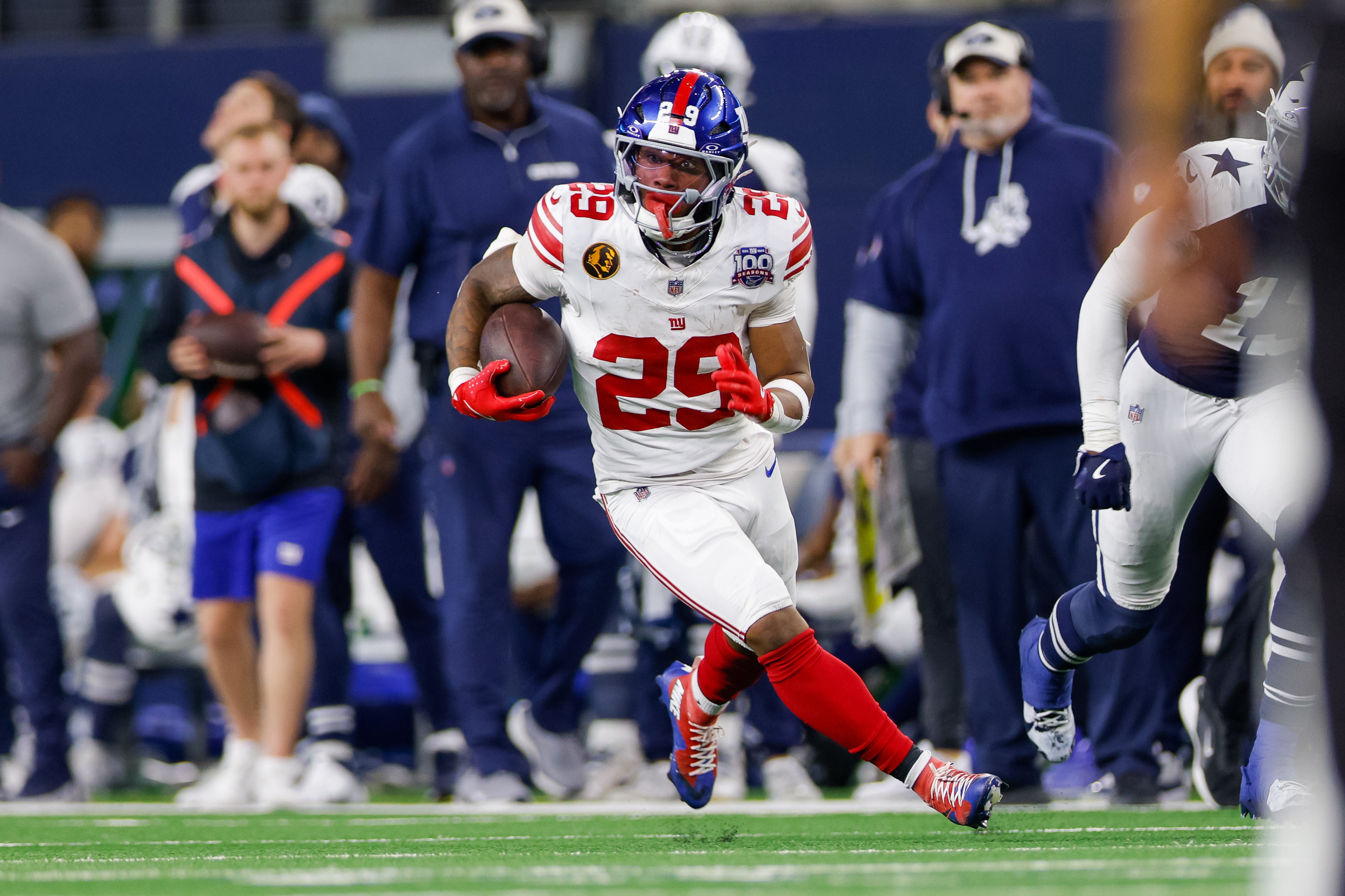 Nov 28, 2024; Arlington, Texas, USA; New York Giants running back Tyrone Tracy Jr. (29) runs during the fourth quarter against the Dallas Cowboys at AT&T Stadium.
