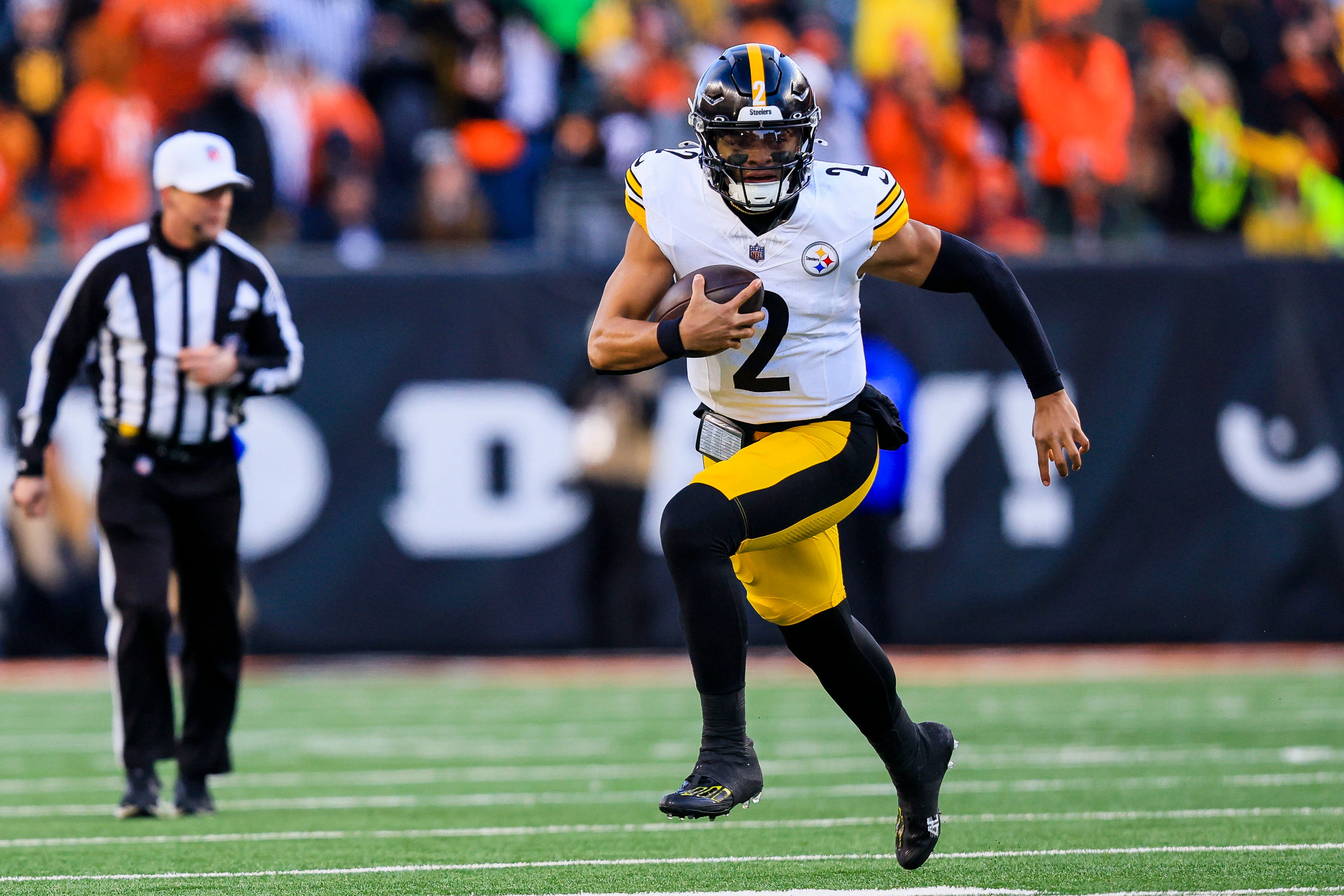 Dec 1, 2024; Cincinnati, Ohio, USA; Pittsburgh Steelers quarterback Justin Fields (2) runs with the ball against the Cincinnati Bengals in the second half at Paycor Stadium.