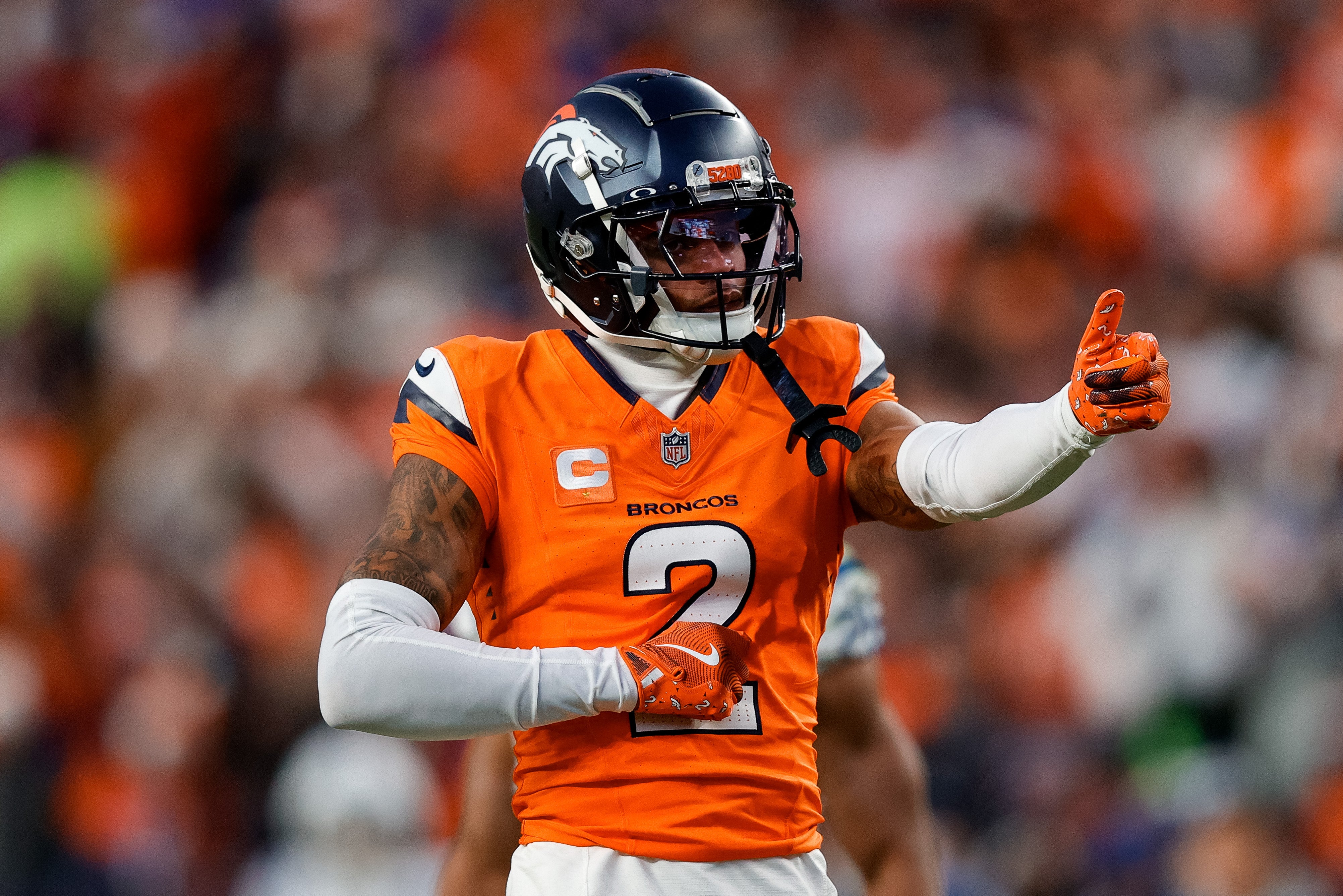 Dec 15, 2024; Denver, Colorado, USA; Denver Broncos cornerback Pat Surtain II (2) gestures after a play in the third quarter against the Indianapolis Colts at Empower Field at Mile High.
