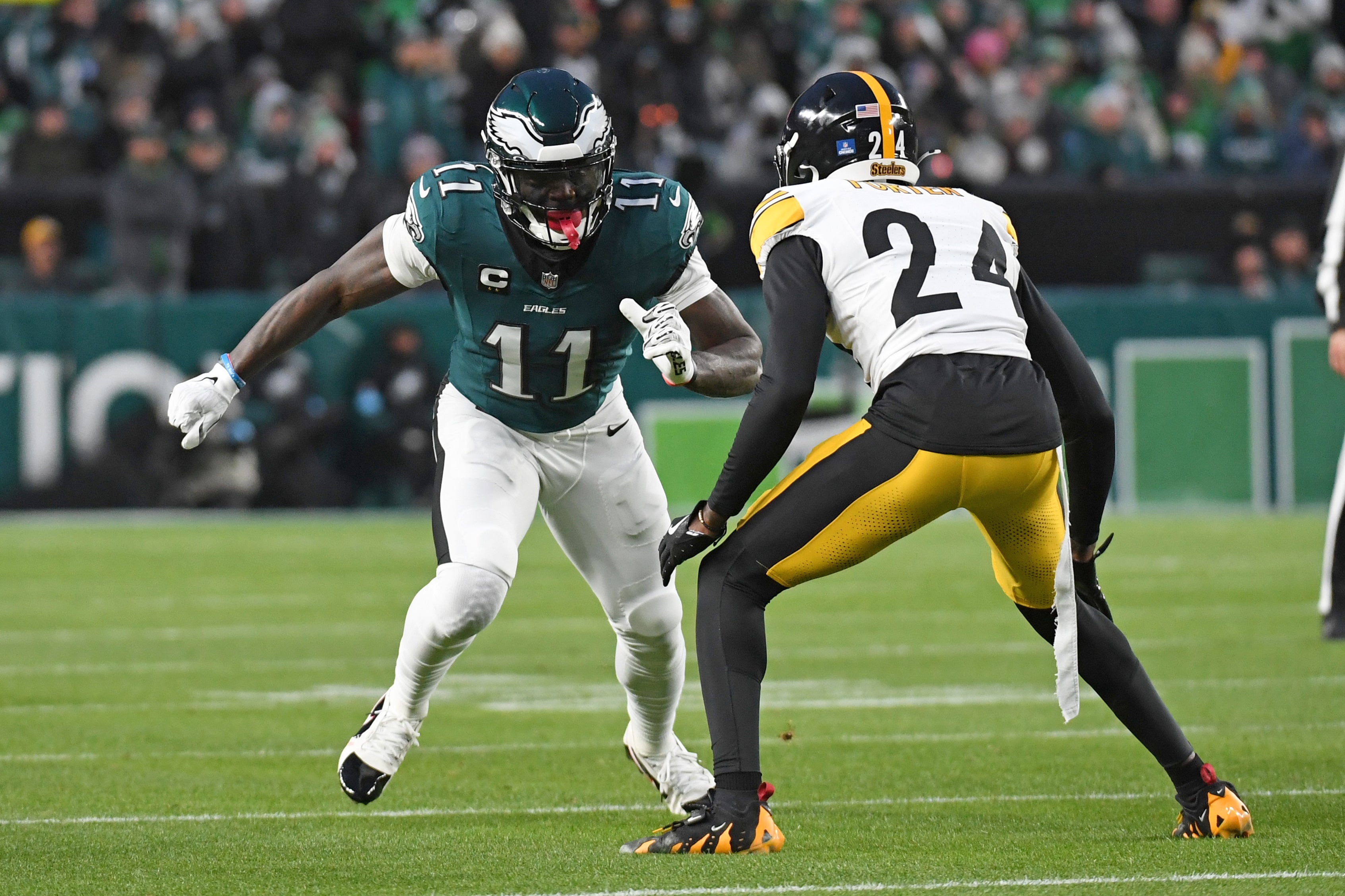 Dec 15, 2024; Philadelphia, Pennsylvania, USA; Philadelphia Eagles wide receiver A.J. Brown (11) is defended by Pittsburgh Steelers cornerback Joey Porter Jr. (24) at Lincoln Financial Field.