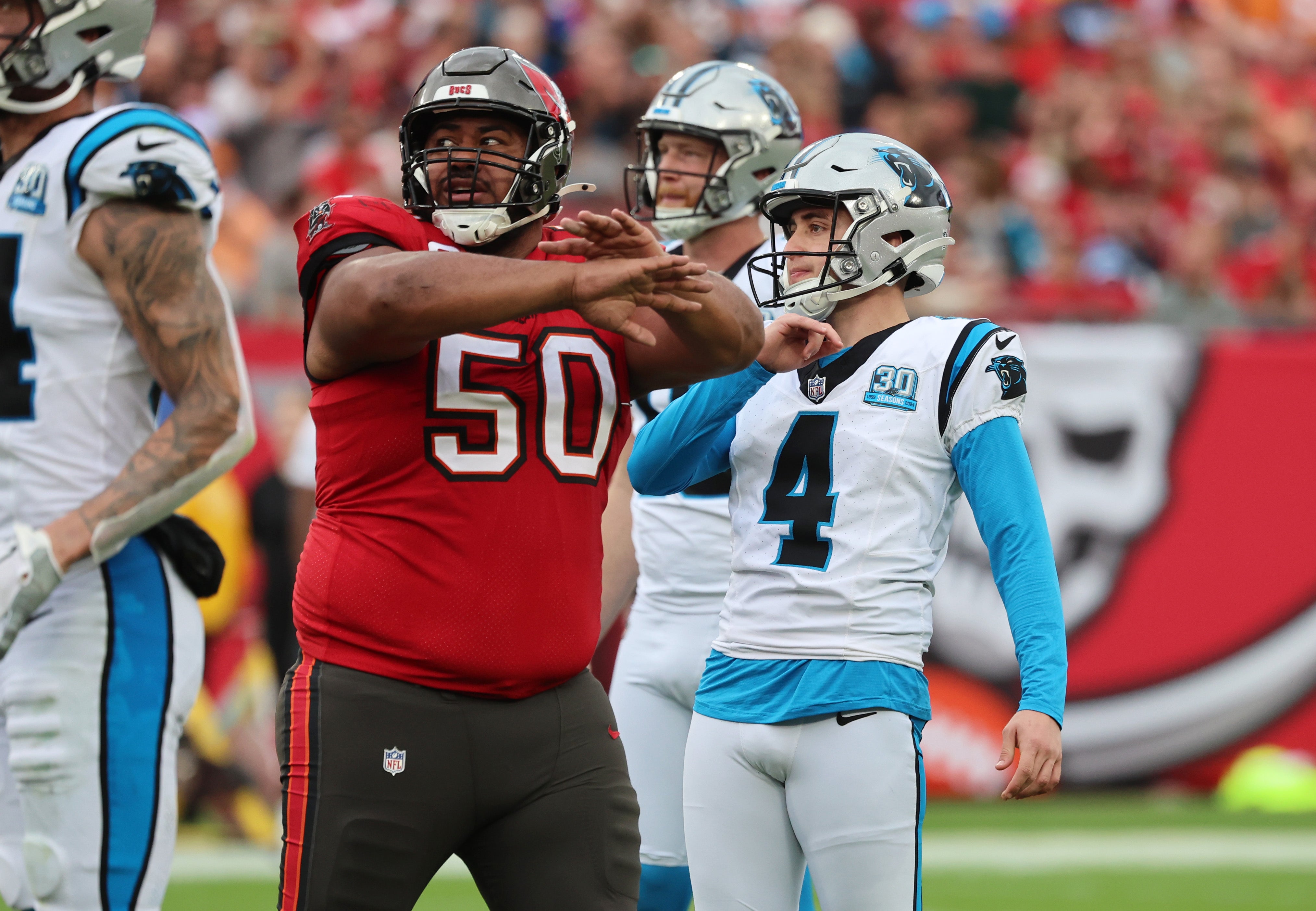 Dec 29, 2024; Tampa, Florida, USA; Tampa Bay Buccaneers defensive tackle Vita Vea (50) reacts after Carolina Panthers place kicker Eddy Pineiro (4) misses an extra point during the second quarter at Raymond James Stadium.