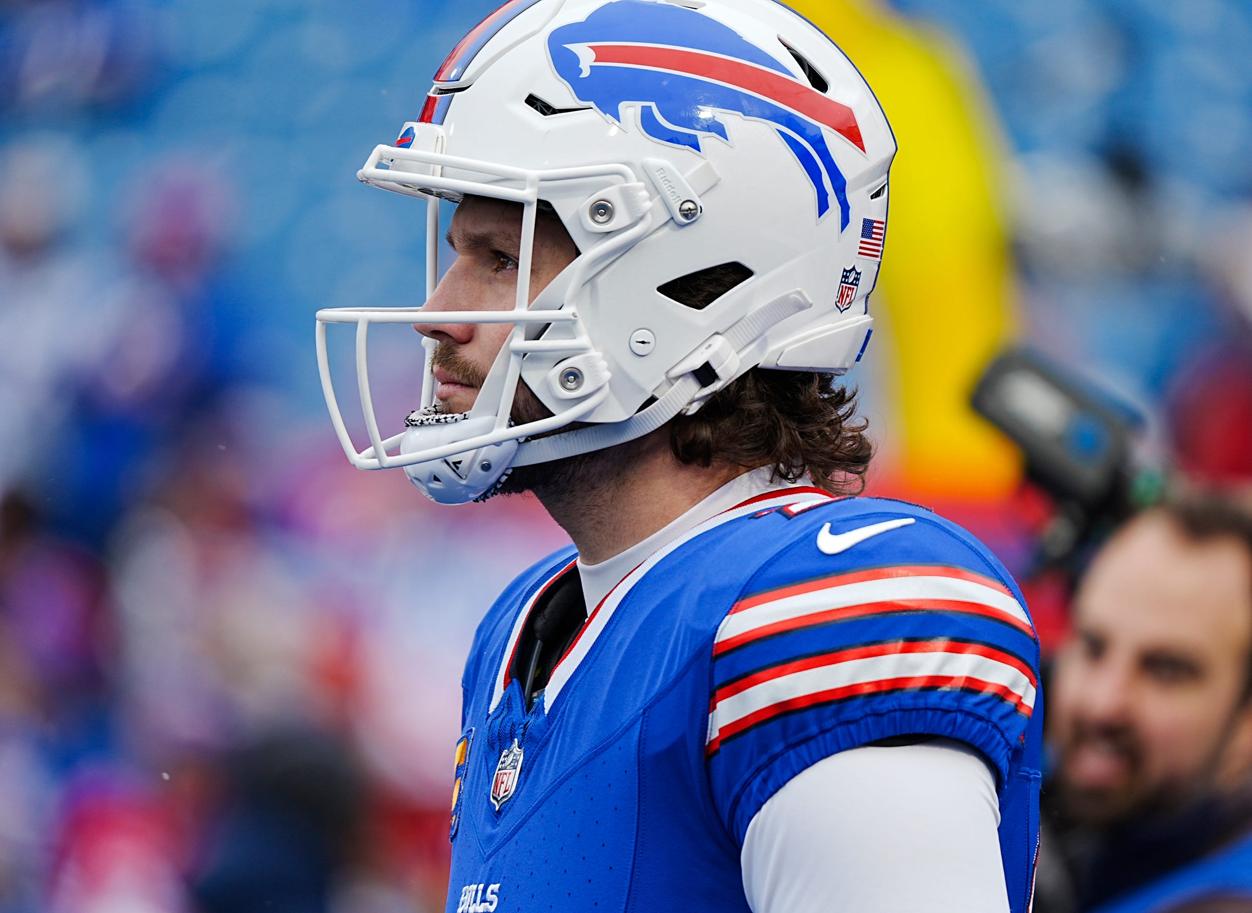 Buffalo Bills quarterback Josh Allen (17) watches warm ups before the Buffalo Bills wild card game against the Denver Broncos at Highmark Stadium in Orchard Park on Jan. 12, 2025.