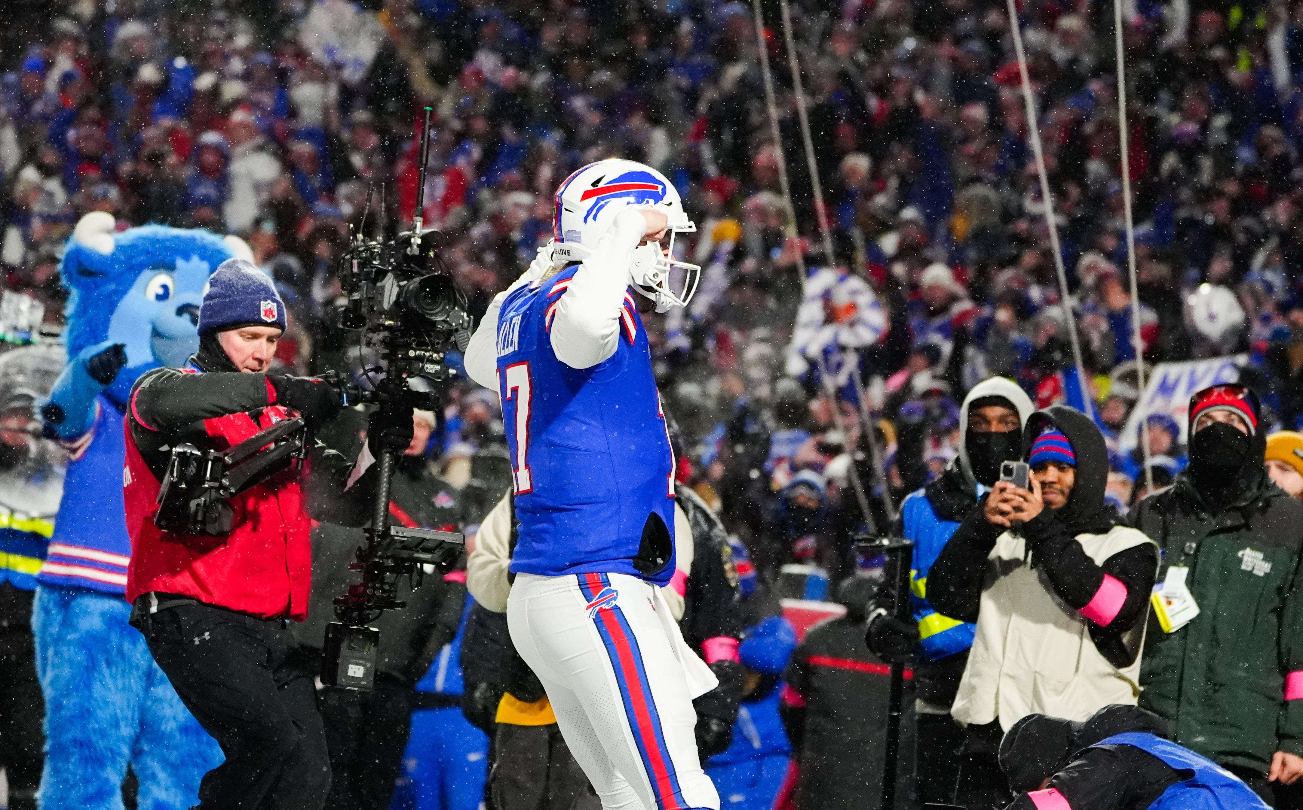 Jan 19, 2025; Orchard Park, New York, USA; Buffalo Bills quarterback Josh Allen (17) celebrates after scoring a touchdown against the Baltimore Ravens during the second quarter in a 2025 AFC divisional round game at Highmark Stadium.
