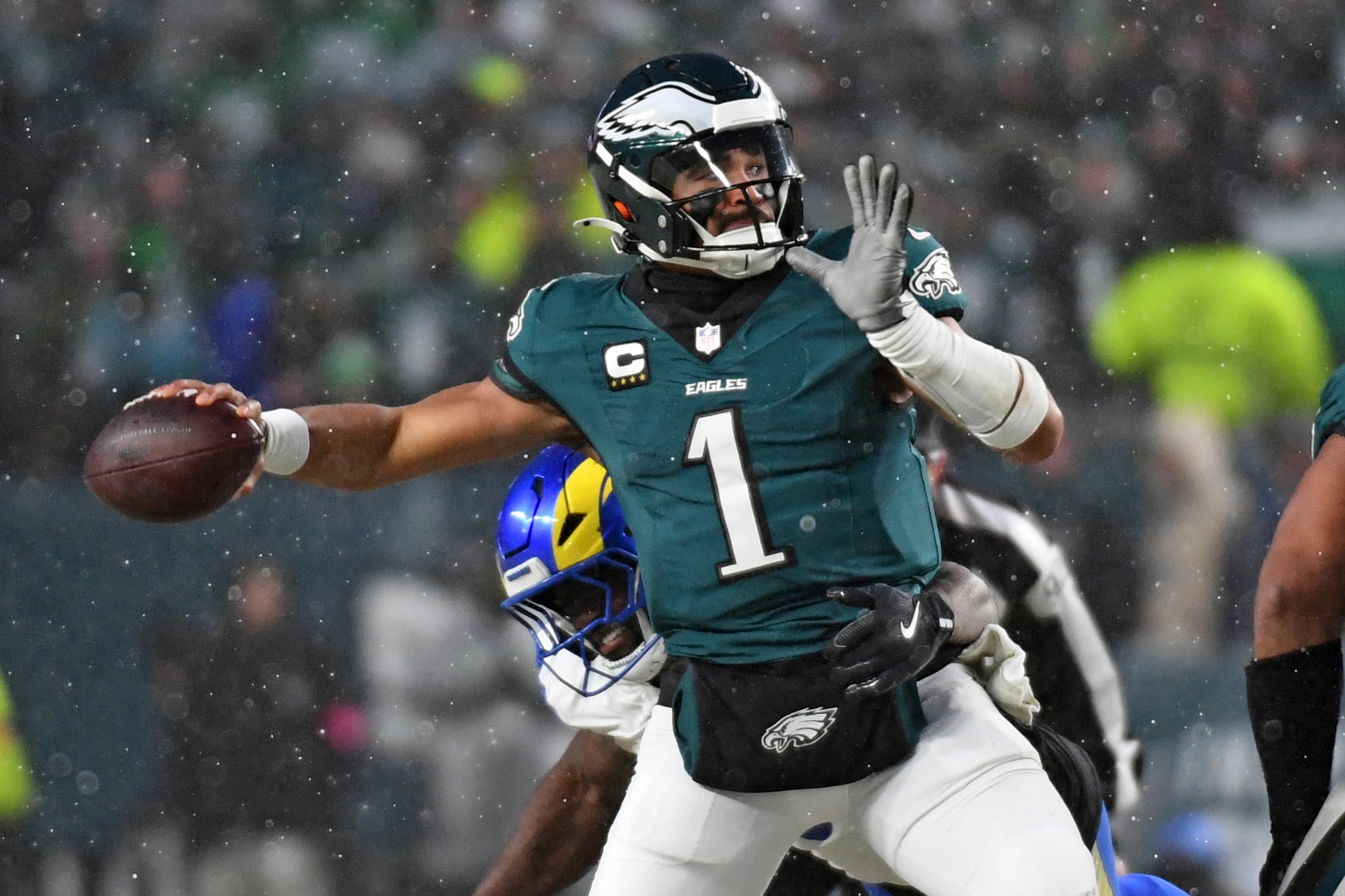 Philadelphia Eagles quarterback Jalen Hurts (1) throws a pass against the Los Angeles Rams in a 2025 NFC divisional round game at Lincoln Financial Field.