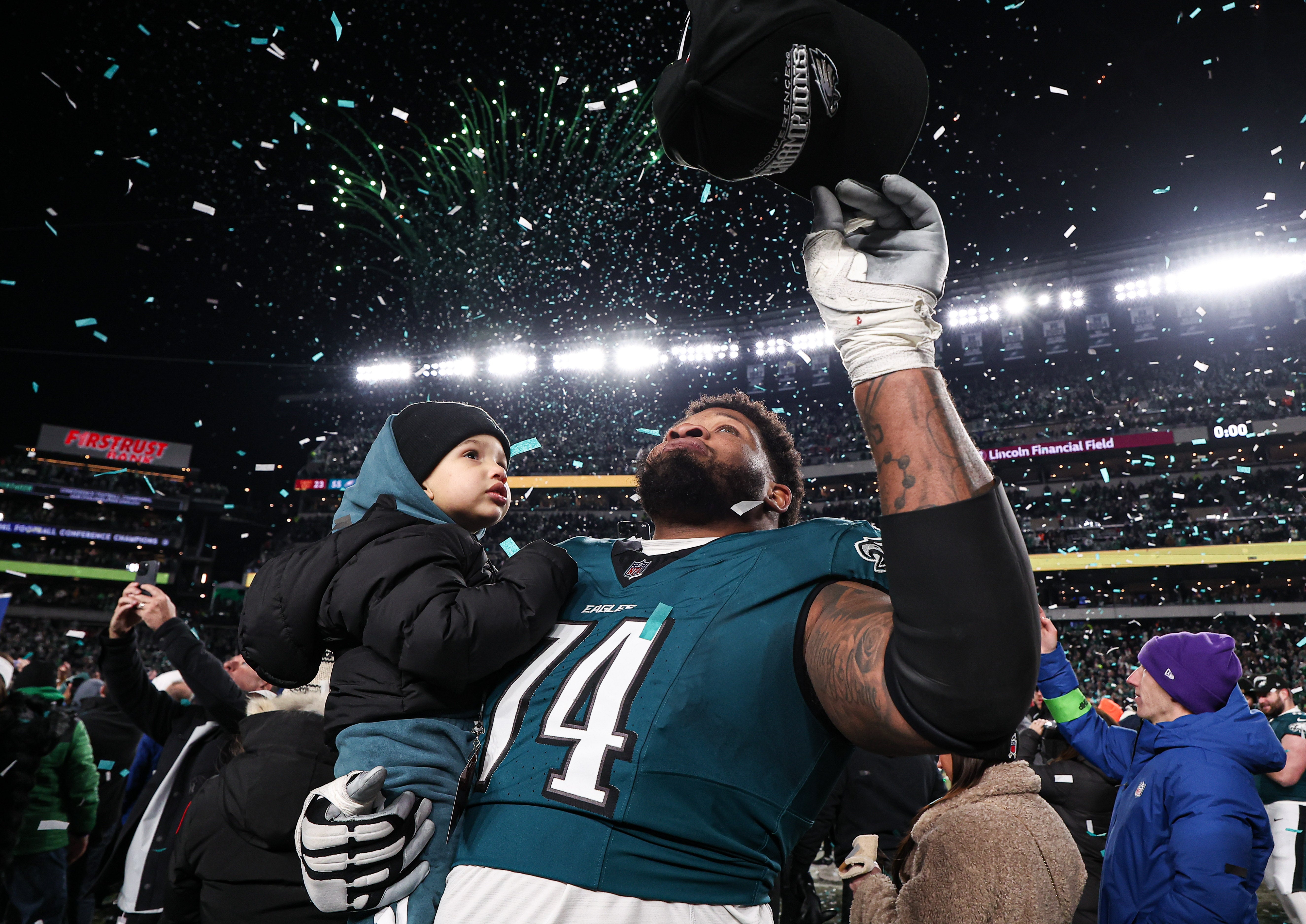Philadelphia Eagles offensive tackle Fred Johnson (74) celebrates after a victory in the NFC Championship game against the Washington Commanders at Lincoln Financial Field.