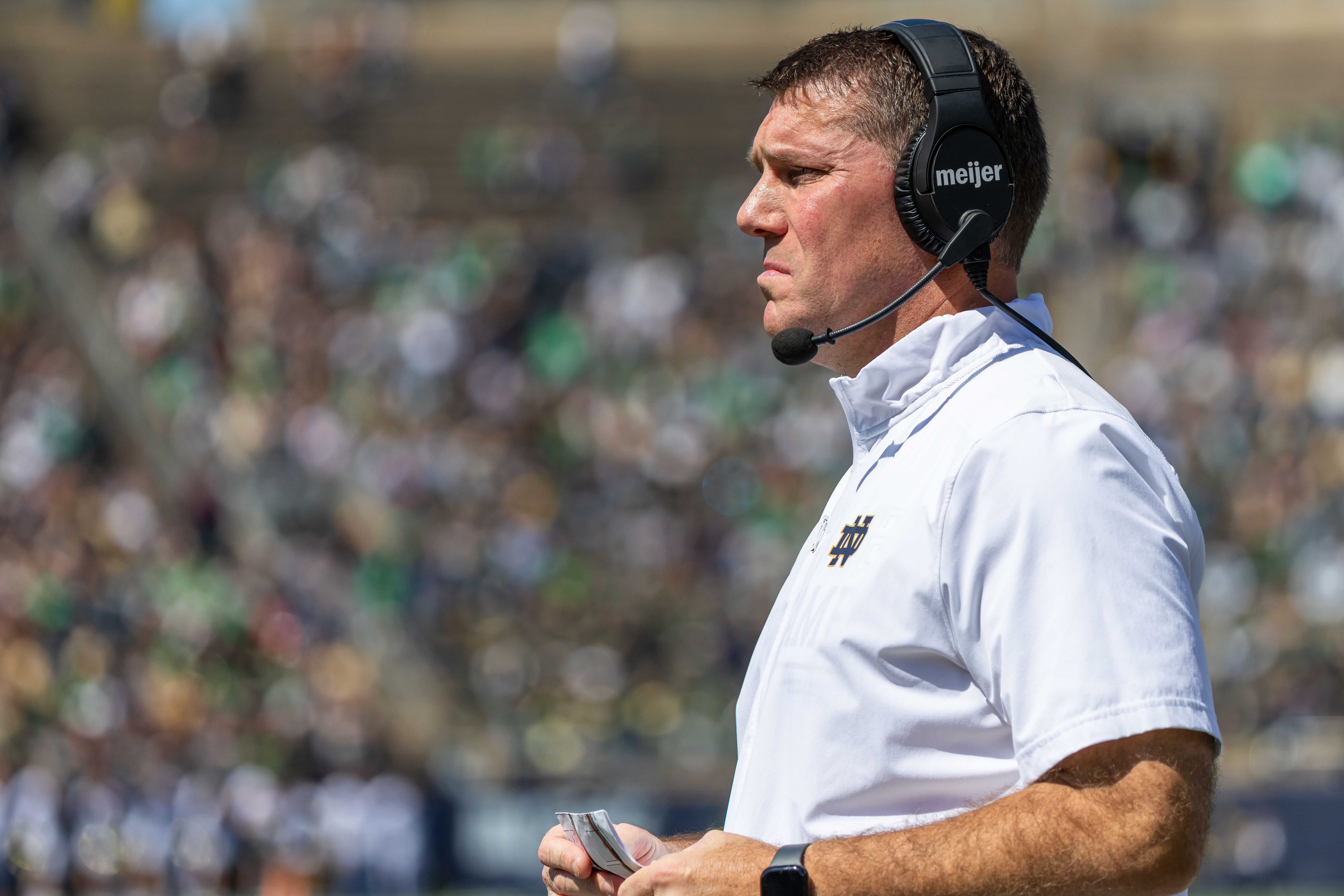 Apr 12, 2025; Notre Dame, IN, USA; Notre Dame defensive coordinator Chris Ash watches during the Blue-Gold game at Notre Dame Stadium. Mandatory Credit: Michael Caterina-Imagn Images