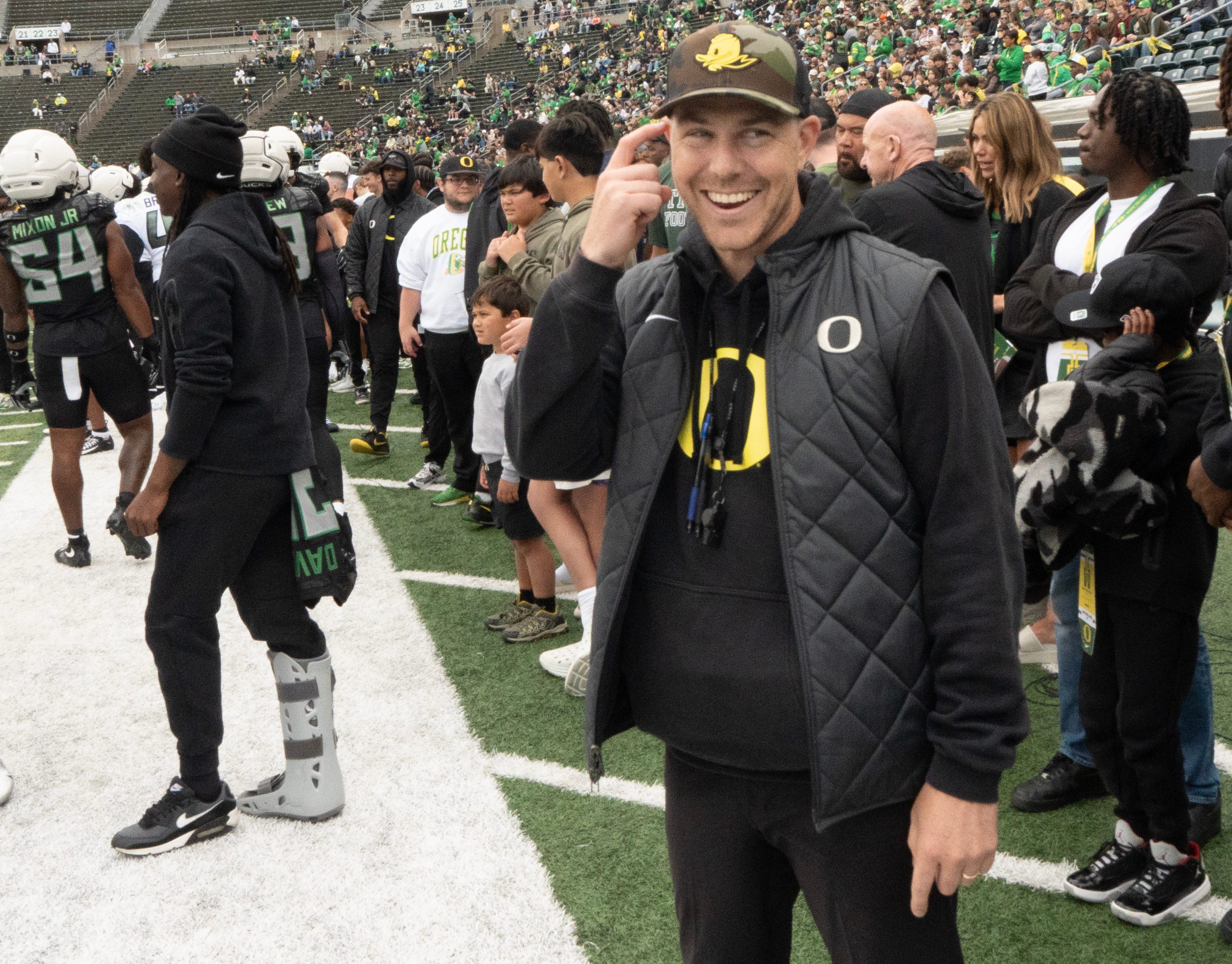 Oregon offensive coordinator Will Stein jokes on the sidelines during the Spring Game at Autzen Stadium.