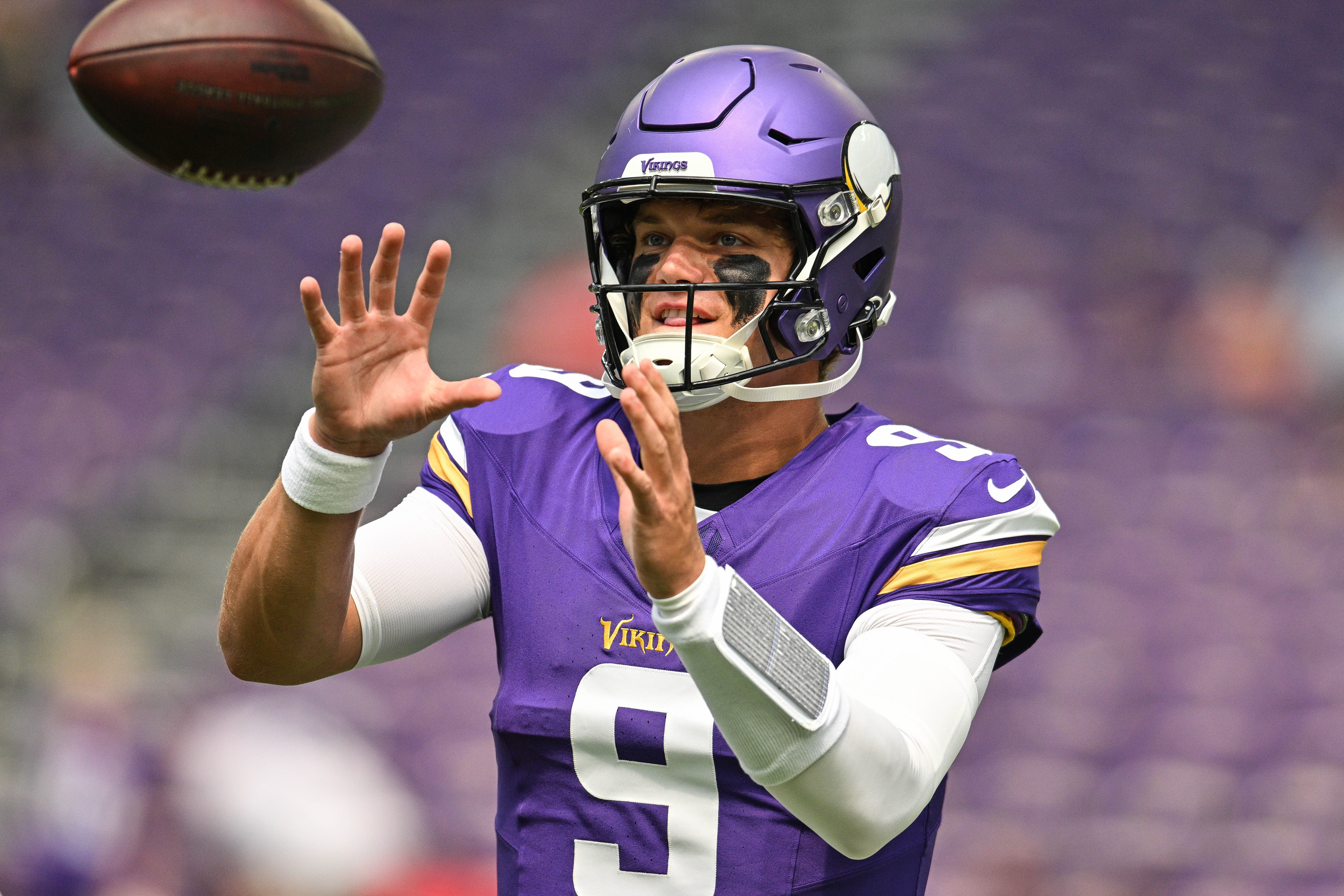 Aug 9, 2025; Minneapolis, Minnesota, USA; Minnesota Vikings quarterback J.J. McCarthy (9) warms up before the game against the Houston Texans at U.S. Bank Stadium.