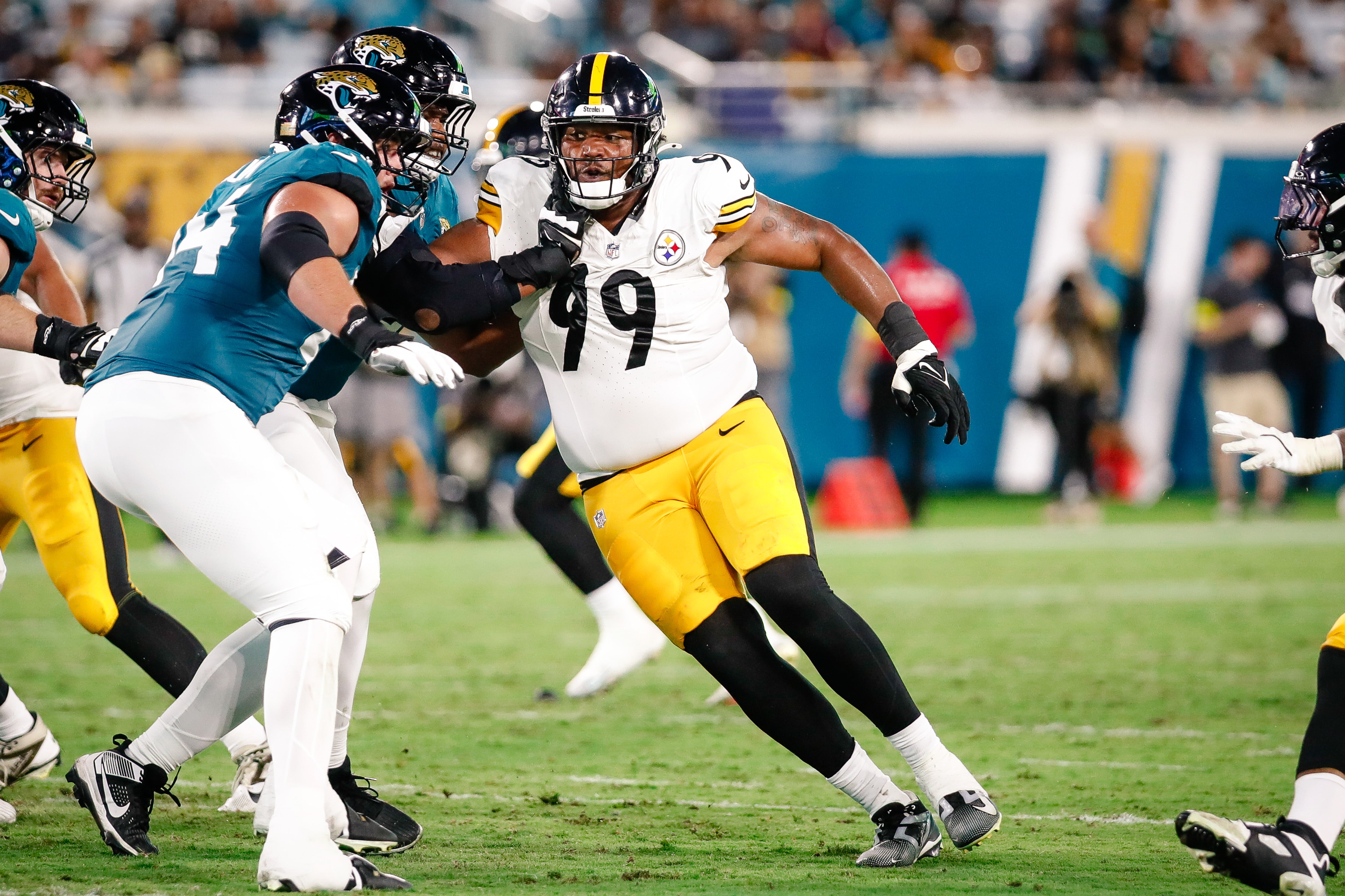 Aug 9, 2025; Jacksonville, Florida, USA; Pittsburgh Steelers defensive tackle Derrick Harmon (99) rushes the passer against the Jacksonville Jaguars during a preseason game at EverBank Stadium.