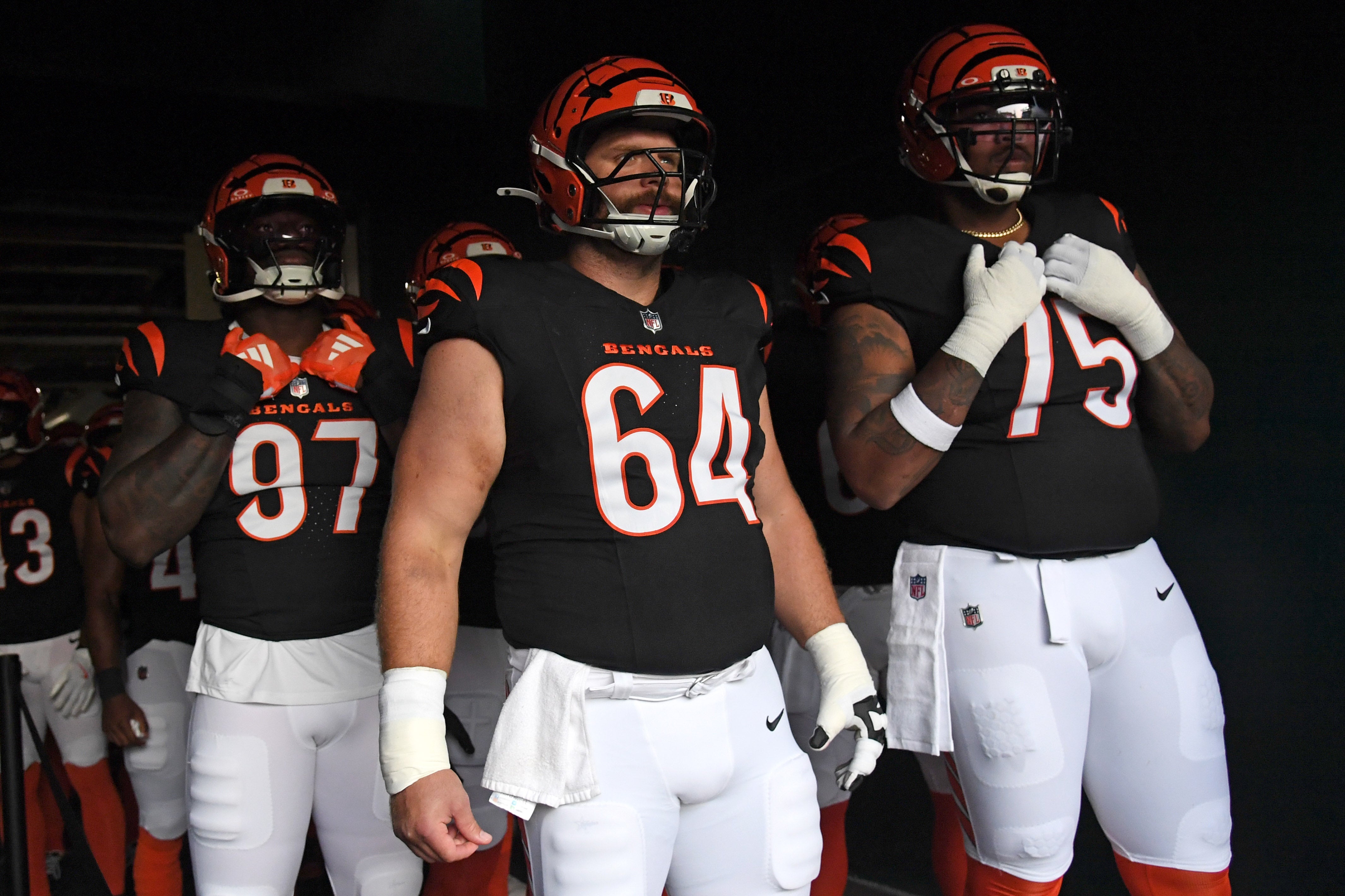 Aug 7, 2025; Philadelphia, Pennsylvania, USA; Cincinnati Bengals defensive end Shemar Stewart (97), center Ted Karras (64) and offensive tackle Orlando Brown Jr. (75) in the tunnel against the Philadelphia Eagles at Lincoln Financial Field.