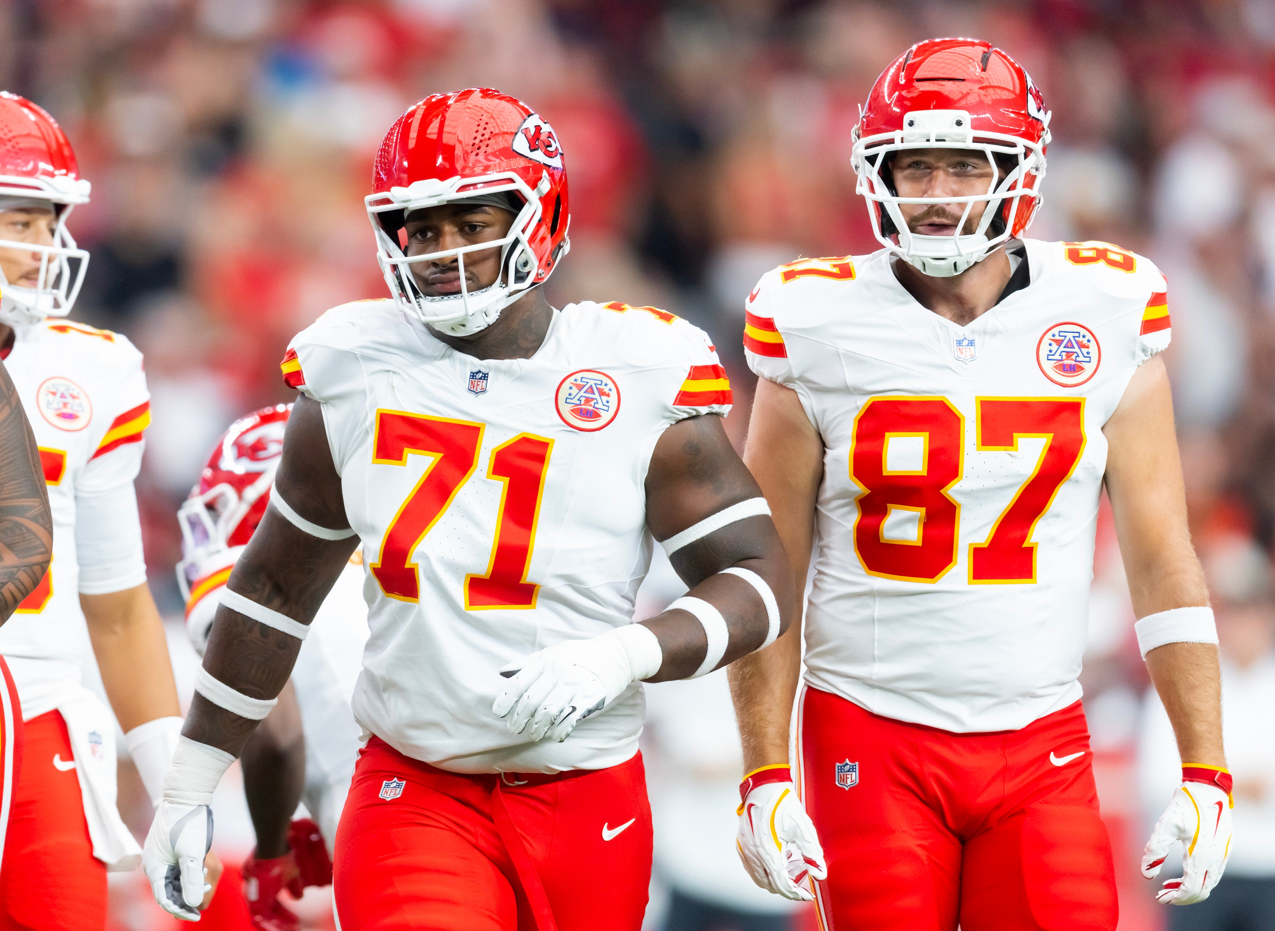 Aug 9, 2025; Glendale, Arizona, USA; Kansas City Chiefs offensive tackle Josh Simmons (71) and tight end Travis Kelce (87) against the Arizona Cardinals during a preseason NFL game at State Farm Stadium.