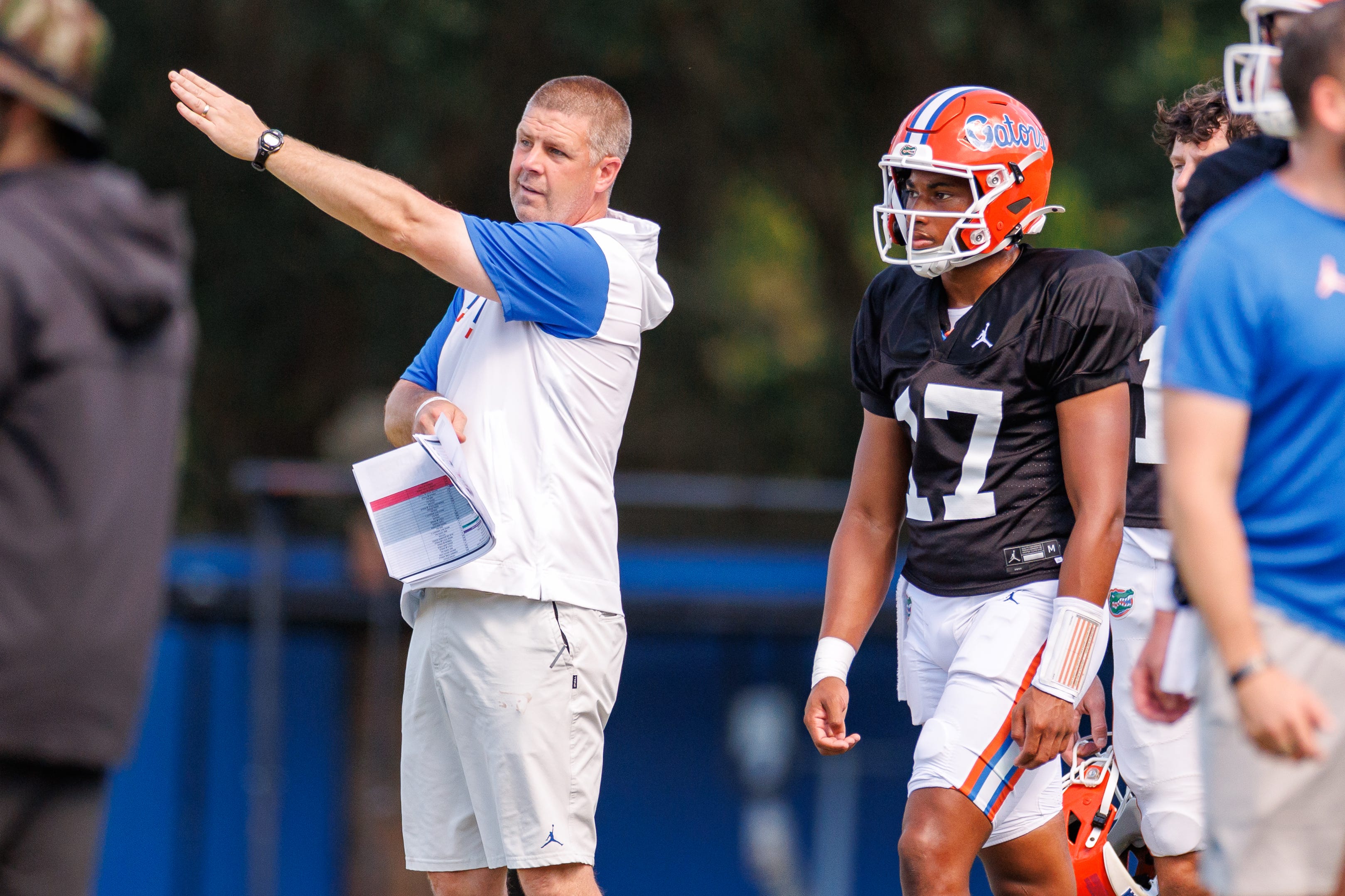 Florida Gators head coach Billy Napier gestures towards Florida Gators quarterback Tramell Jones Jr. (17) during fall football practice at Heavener Football Complex at the University of Florida in Gainesville, FL on Tuesday, August 12, 2025.