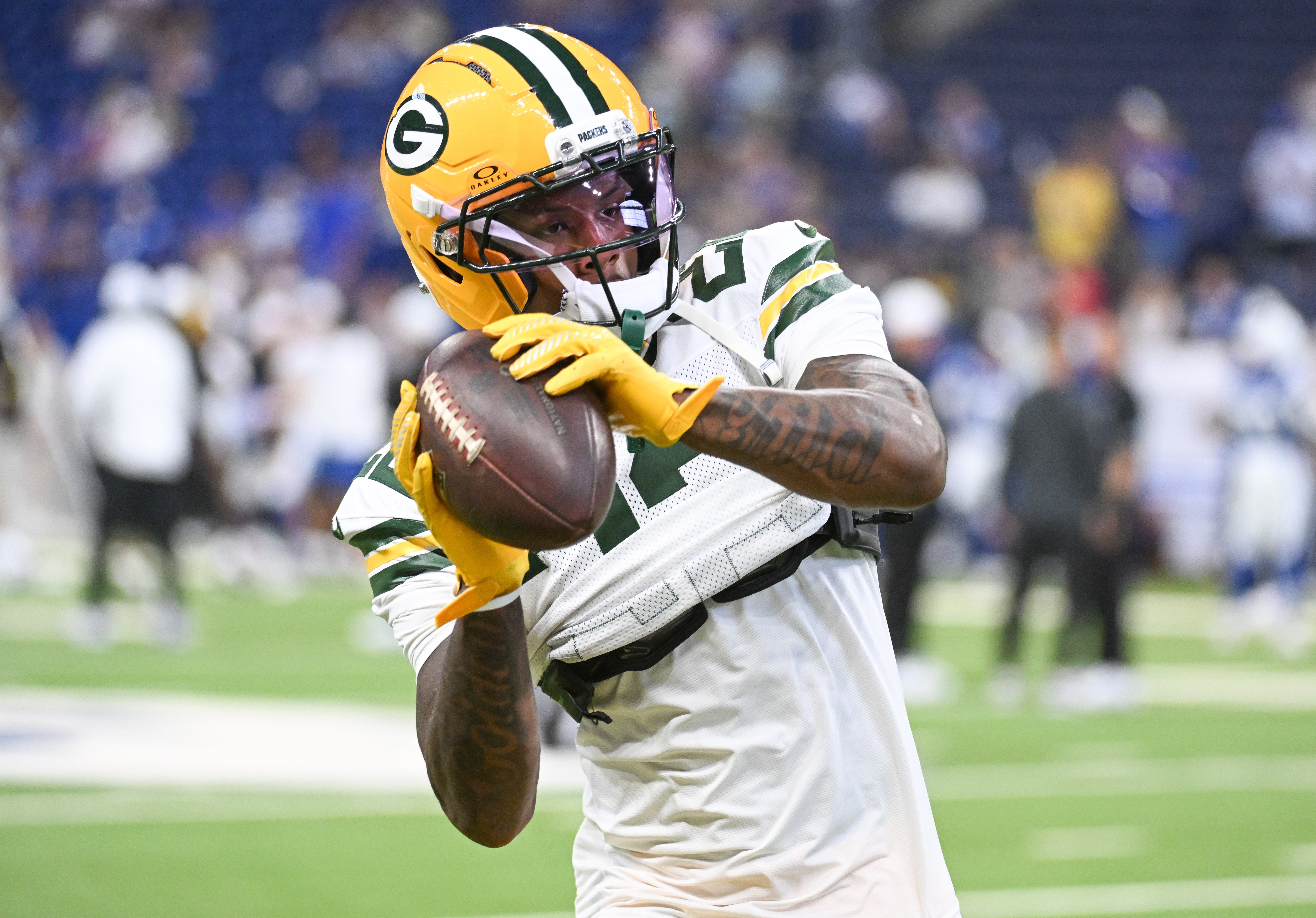Aug 16, 2025; Indianapolis, Indiana, USA; Green Bay Packers wide receiver Matthew Golden (22) catches a pass during warmups prior to the game against the Indianapolis Colts at Lucas Oil Stadium.