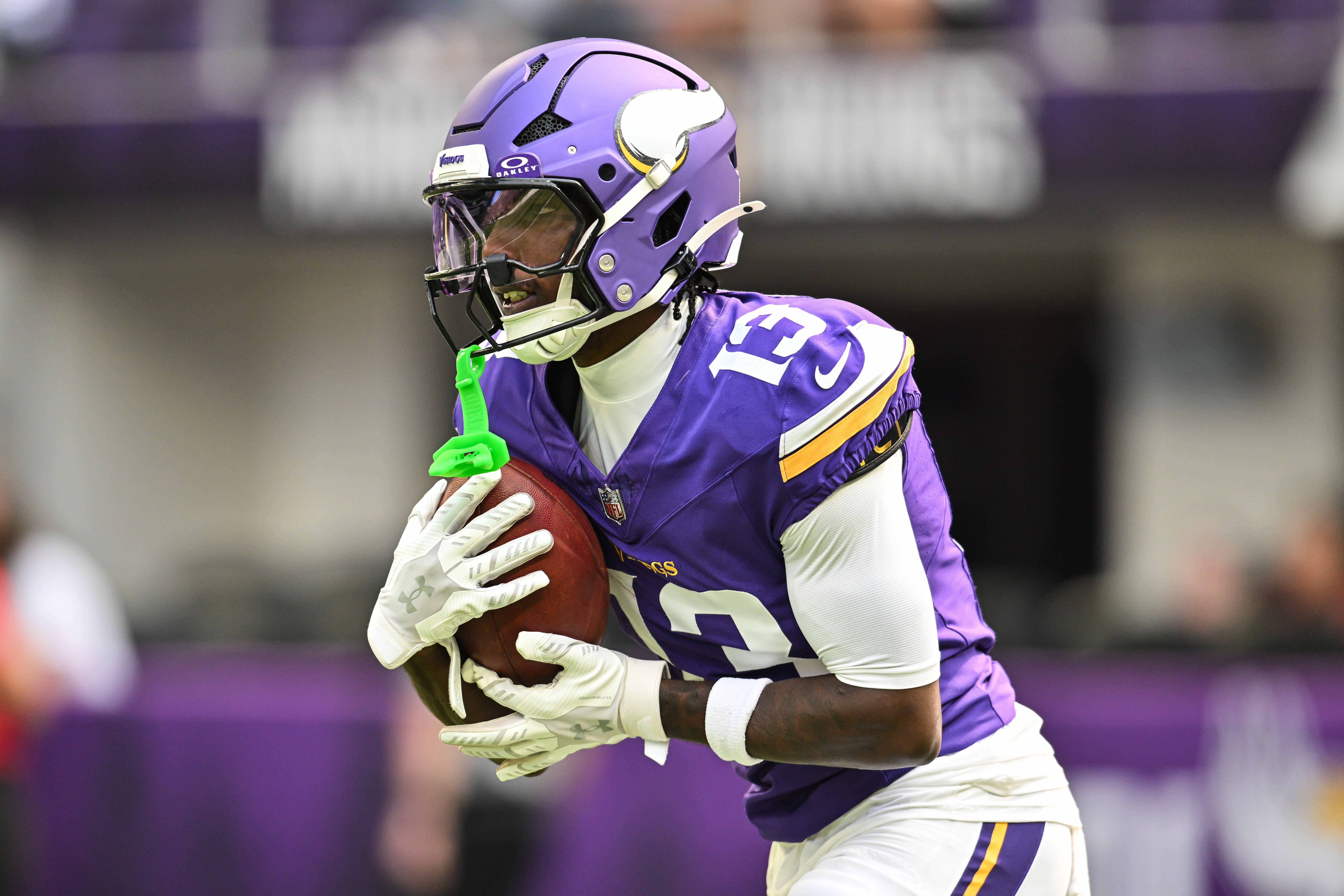 Aug 16, 2025; Minneapolis, Minnesota, USA; Minnesota Vikings wide receiver Tai Felton (13) warms up before the game against the New England Patriots at U.S. Bank Stadium.